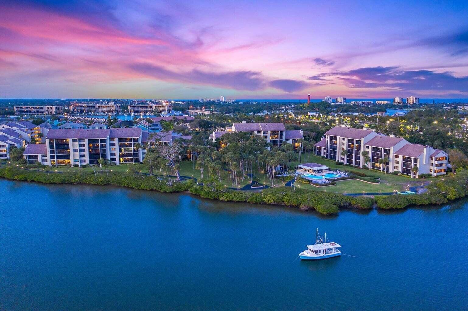 Discover the epitome of coastal luxury with this highly sought-after 2-bedroom, 2-bathroom corner residence at the prestigious 1000 North address in Jupiter Harbour. A haven for those who appreciate breathtaking views, contemporary elegance, and a wealth of nearby amenities. This residence boasts spectacular Intracoastal views, offering mesmerizing sunsets from the expansive private screened-in balcony. The thoughtfully designed split floor plan provides privacy, with the guest room featuring its own sliding door to the second screened terrace and ensuite bathroom, creating an ideal second master bedroom. Experience the luxury of a second private screened-in balcony off the dining room area, perfect for al fresco dining and entertaining. (more) The upgraded kitchen is a chef's delight, featuring stainless steel appliances, including a new Bosch dishwasher, a glass top stove with double oven, under-cabinet lighting, softclose cabinets and pullout drawers, and granite countertops. Elegant hardwood floors enhance the sophistication of the living room and bedrooms. Hurricane shutters ensure peace of mind, and the new AC system installed in 2017 with 10 kw with UVC system plus ironizing electronice air cleaner with lifetime warranty that contributes to improved air quality. Ample storage space is available, with a spacious laundry room, numerous closets inside, and additional storage outside.
Benefit from the added value of a brand-new roof installed in 2024, ensuring long-term durability and reducing any concerns for the new homeowner. Enjoy the exclusivity of Jupiter Harbour, a 24/7 guard-gated community offering a heated pool/spa, lighted tennis/pickleball courts, and picturesque walking paths along the community and the Intracoastal. Spot dolphins, manatees, sea turtles, otters, and a variety of beautiful birds during your morning strolls or fishing excursions. Convenience is at your fingertips, with assigned covered parking and storage just steps away, and plenty of guest parking available. Indulge in the vibrant lifestyle with proximity to Jupiter's best restaurants, shopping plazas, Harbourside, Riverwalk, and iconic landmarks like the Jupiter Lighthouse. Experience the unique transportation convenience of Zeke's golf cart taxi service, available to pick you up right from the Jamaica building. Outdoor adventures await, with activities like paddleboarding, kayaking, snorkeling, and more, all within reach of Dubois Park, Burt Reynolds Park, and the Loxahatchee River Museum. Your new adventure awaits in this exceptional residence at 1000 North - Jupiter Harbour. Schedule a private showing and embrace the unparalleled lifestyle that comes with this remarkable property.