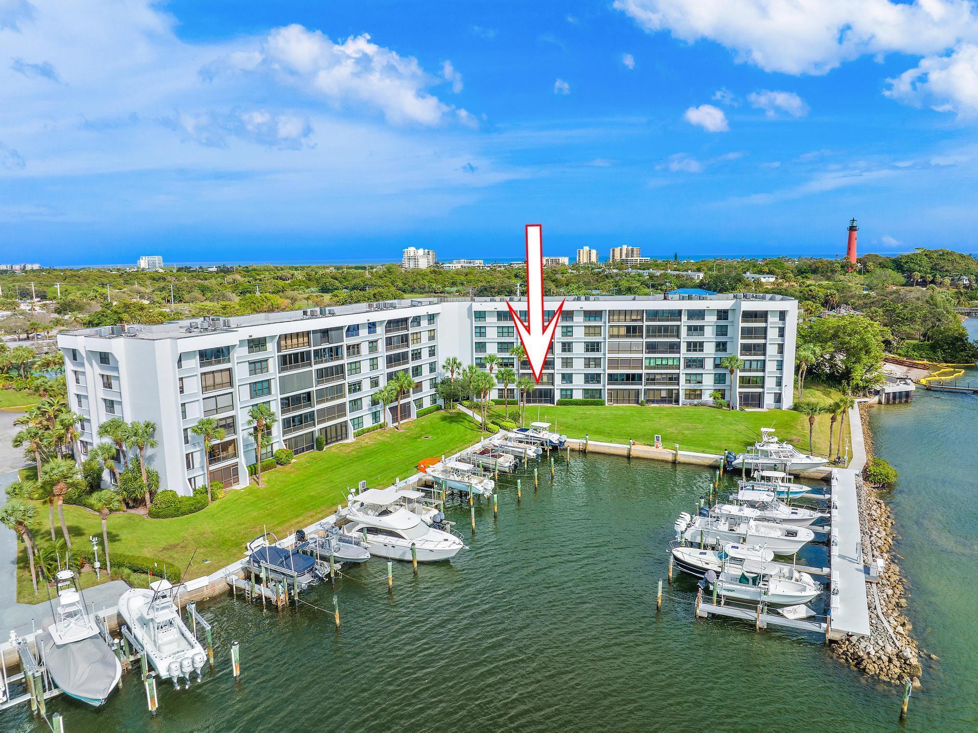 Enjoy amazing views of Jupiter Inlet and the Intracoastal from your new waterfront home in Jupiter Cove, where the Loxahatchee River, Jupiter Inlet and Intracoastal all converge offering easy access to the Atlantic Ocean. Step out the back door to your private marina, or simply relax and enjoy sunset views from your porch. Ground floor unit updated with beachy neutral colors, Luxury Vinyl Plank flooring, and brand new appliances. New A/C and Water Heater in 2022..Jupiter Cove offers a marina with up to 40' boat slips available for rent or purchase when available, tennis, Pickleball, gated security, onsite management, kayak storage, a clubhouse and swimming pool. Check out the waterfront Tiki Bar with grilling and a private beach perfect for wading to the sandbar. Jupiter Cove, located in the heart of Jupiter, is close to Tequesta, the beach, world class golf courses, US1, A1A, dining, shopping, and everything that makes Jupiter one of the most sought after towns in South Florida.