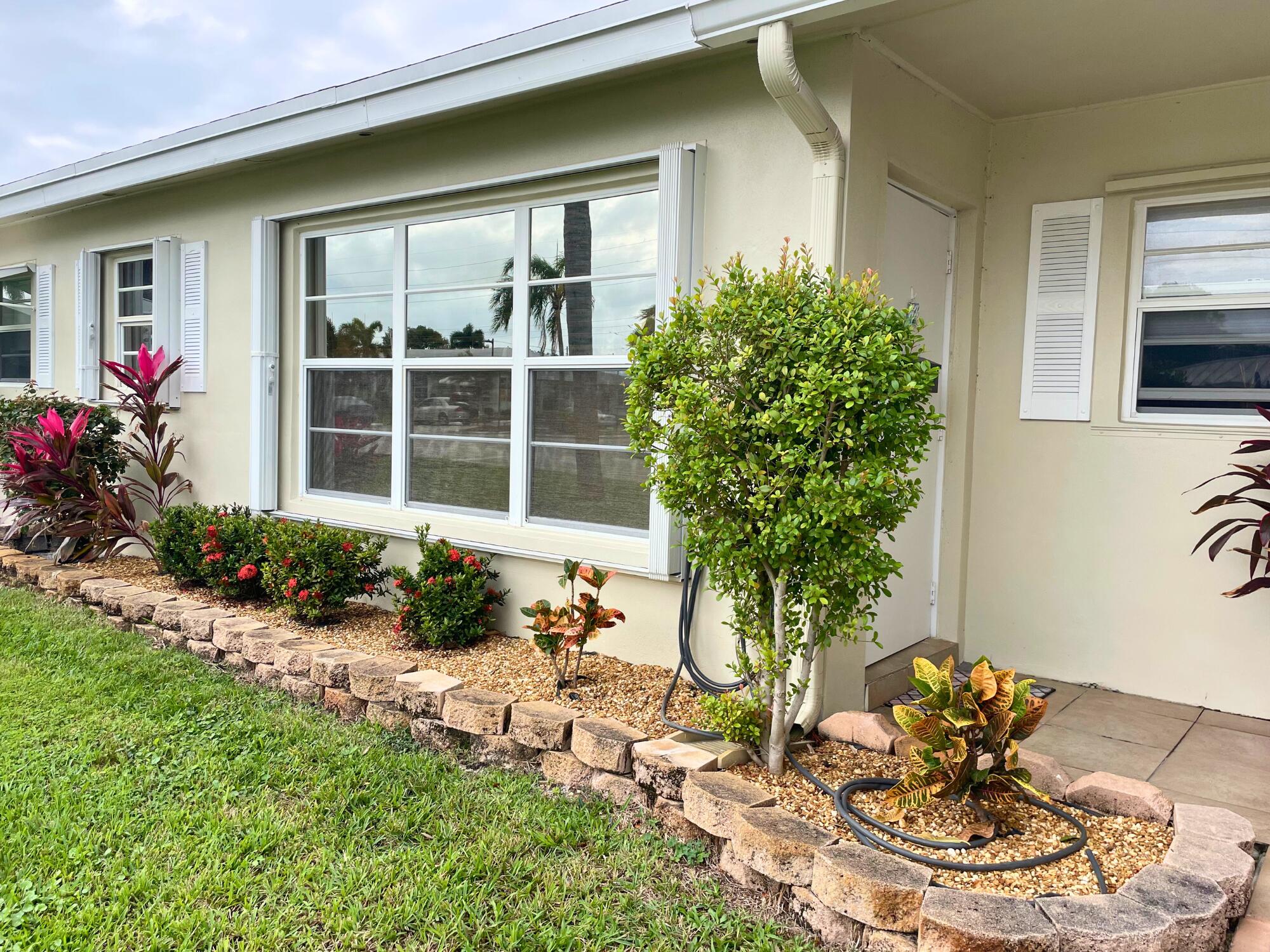 Discover this hidden little gem that could be your perfect home in Boynton Beach's Pine Point Villas subdivision with this charming unit, it can be turnkey or put all your own touches on this one-bedroom 1.5 bath. Spanning 880 square feet, a very well-maintained property featuring laminate and tile flooring, updated kitchen and baths which brings both comfort and convenience.The villa's ideal location across from the community pool adds to its appeal, providing a beautiful view and easy access to relaxation. Whether as a winter getaway or a full-time residence, this villa is ready for you to move in and enjoy immediately.