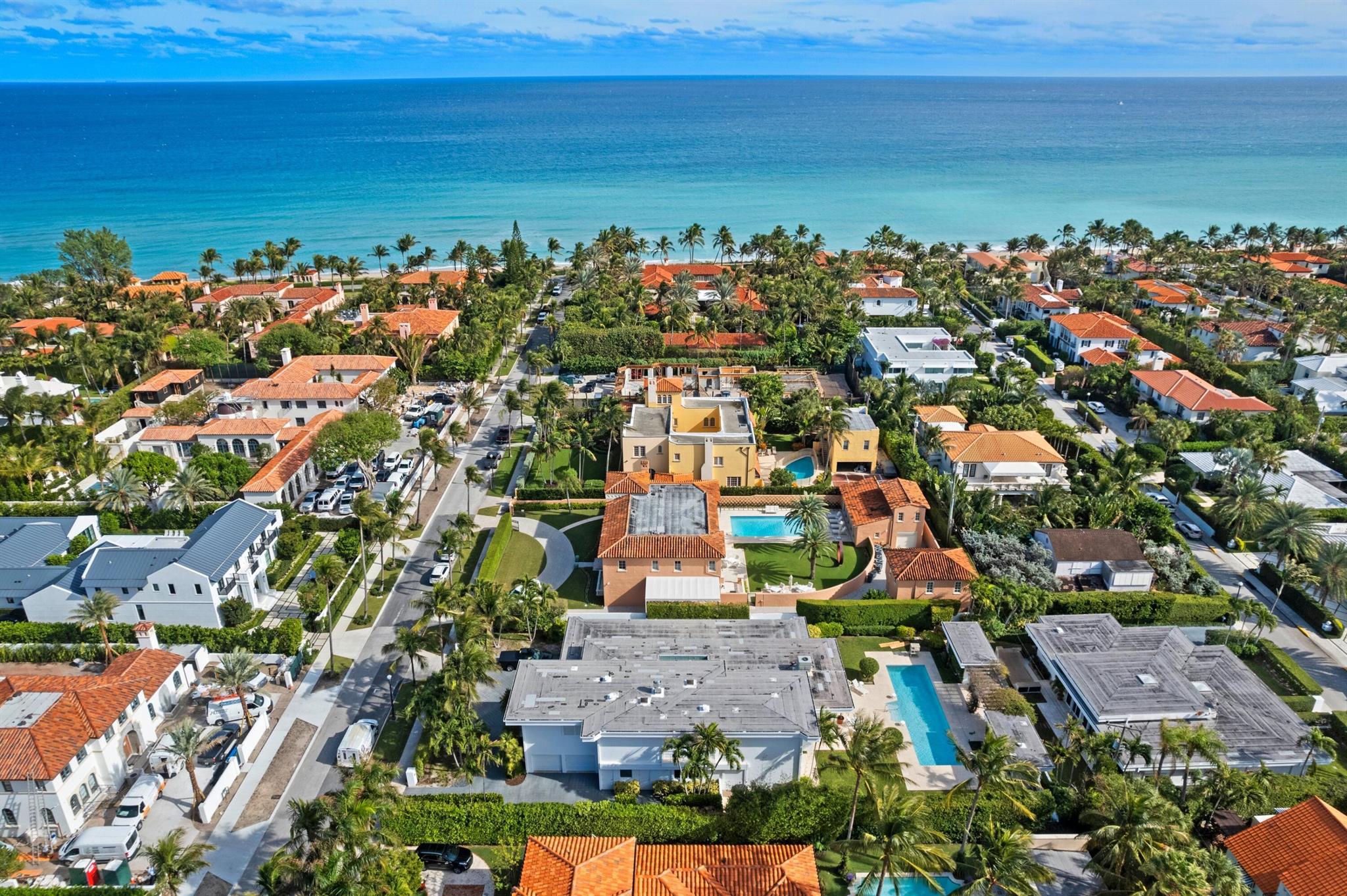 This rare midtown compound, encompassing 150 Dunbar Rd. and 151 Atlantic Ave., boasts two private residences designed by Gene Lawrence, famed for The Esplanade, Neiman Marcus, Cafe L'Europe, and other Palm Beach establishments. It includes a total of 9 bedrooms across over 11,200 SF total space. A spacious backyard, featuring a heated lap pool with cabana bath and storage, separates the two homes. The 29,600+ SF lot extends from Dunbar Rd. to Atlantic Ave., presenting an exceptional opportunity for buyers to either renovate or build new.The primary residence, a two-story structure encompassing 5,732 SF under air, is designed around an atrium and offers 5 bedrooms (including an upstairs apartment with lounge and kitchenette), several living spaces, a formal dining room, a kitchen with an adjacent butler's pantry, a 2-car garage, and space for an elevator installation. The single-story guest house, spreading over 3,127 SF under air, is complete with 4 bedrooms, various living areas, a kitchen, a 2-car garage, and all essentials for both full-time and seasonal living. Each home in the compound has its own entrance, enhancing privacy and versatility. Located just a short distance from the beach, this property is also conveniently near all the dining, shopping, and entertainment options Palm Beach has to offer.