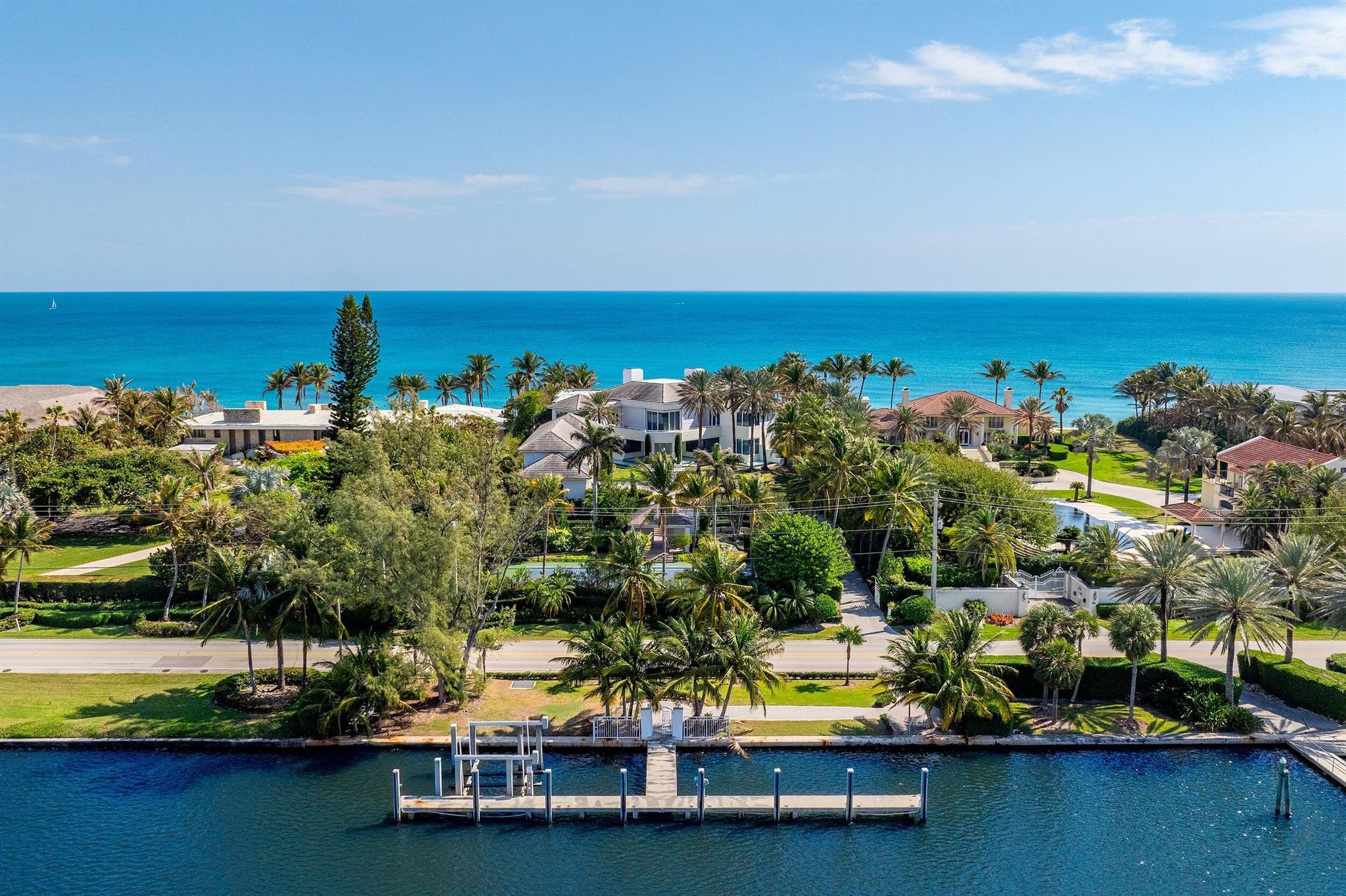 Spectacular Ocean-to-Lake estate with 7 bedrooms, 8 bathrooms and 3 half baths. Highlights include tennis court, boat dock, and oceanfront pool and spa. Light and bright interior living spaces with floor to ceiling windows. Commanding views of the Atlantic Ocean and the Intracoastal Waterway.