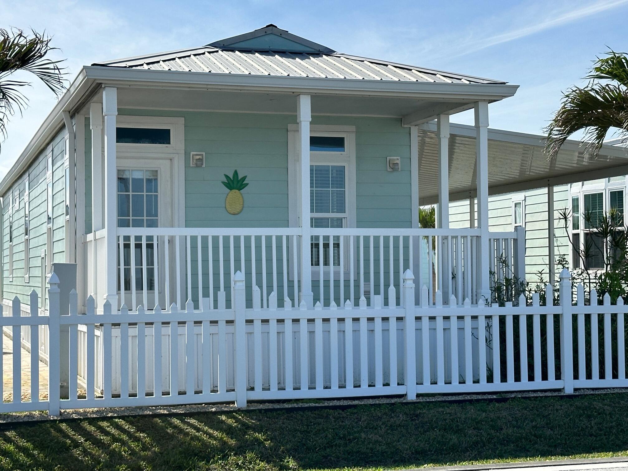 Let the vacation begin! Located in the 55+ Ocean Breeze Resort overlooking beautiful wide water views of the Indian River right off your front porch!. This 2015 built manufactured home boasts impact windows, light & bright rooms with that fabulous water view! A storage shed for all your beach toys but you may never want to leave with all the resort amenities on the property. Walk or cruise over on your golf cart to the clubhouse for dinners, games, live music, dancing and more! Heated pool, hot tub, pickleball, Cafe/Bar, gym, sauna, bocce ball and a dog park for your furry friends. Fishing pier with paddleboard & kayak launch. Downtown Jensen is a short walk to your favorite shops and restaurants...and the ocean beaches are just a 2 mile stone's throw...Live your best life right here!