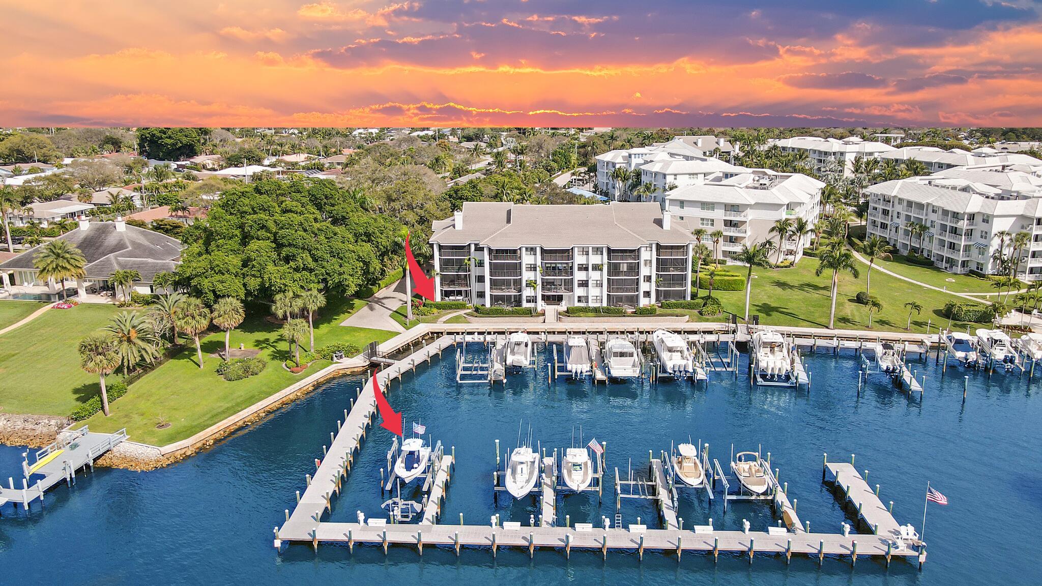 Rarely available, fully renovated 3 bed/2 bath end unit in Bay Colony with unobstructed intracoastal & marina views! Included is also a 42 ft. slip with a 20,000lb Neptune G6 walk around boat lift & a rotating personal watercraft lift! No stone was left unturned when remodeling this unit! Tile flooring throughout, full impact glass, plantation shutters, electric shades, smart lighting, tankless hot water heater, a built-in home office, private wine bar, a custom storage closet/shop with a brand-new freezer, stainless appliances & pot filler in the kitchen with custom cabinetry & countertops, & so much more! There are also private front & back entrances, which gives this condo the feeling of a private home. Enjoy amazing sunsets every day from this one-of-a-kind direct waterfront oasis!