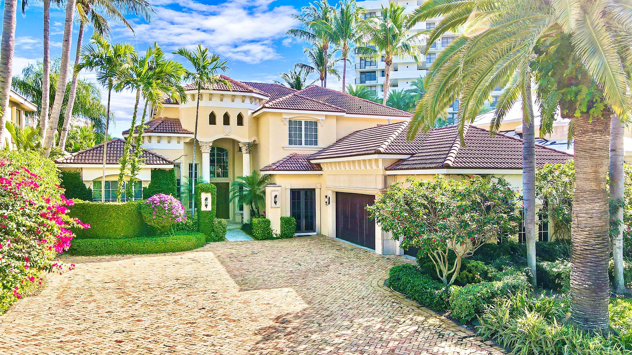 Set on 1/3 acre of lush, tropical landscaping and tucked away in an enchanted corner of the manicured grounds of Boca Highland Beach Club and Marina, this strikingly beautiful 2-story 6BR/5.2BA oceanside Estate is nestled between the sparkling, blue Atlantic and winding Intracoastal, offering a sprawling floorplan perfect for both privacy and entertainment! Upon arriving, you'll be greeted by an over-sized Chicago brick motor court, serene palms, and vine-covered walls. Timeless elegance and thoughtful, luxurious appointments greet you at every turn--from soaring ceilings and striking archways to the gourmet kitchen--complete with hi-end stainless appliances, massive wood island and gas stove--to the movie theater, sauna, steam shower, and 7,238 sq.ft. of amenities too numerous to mention!