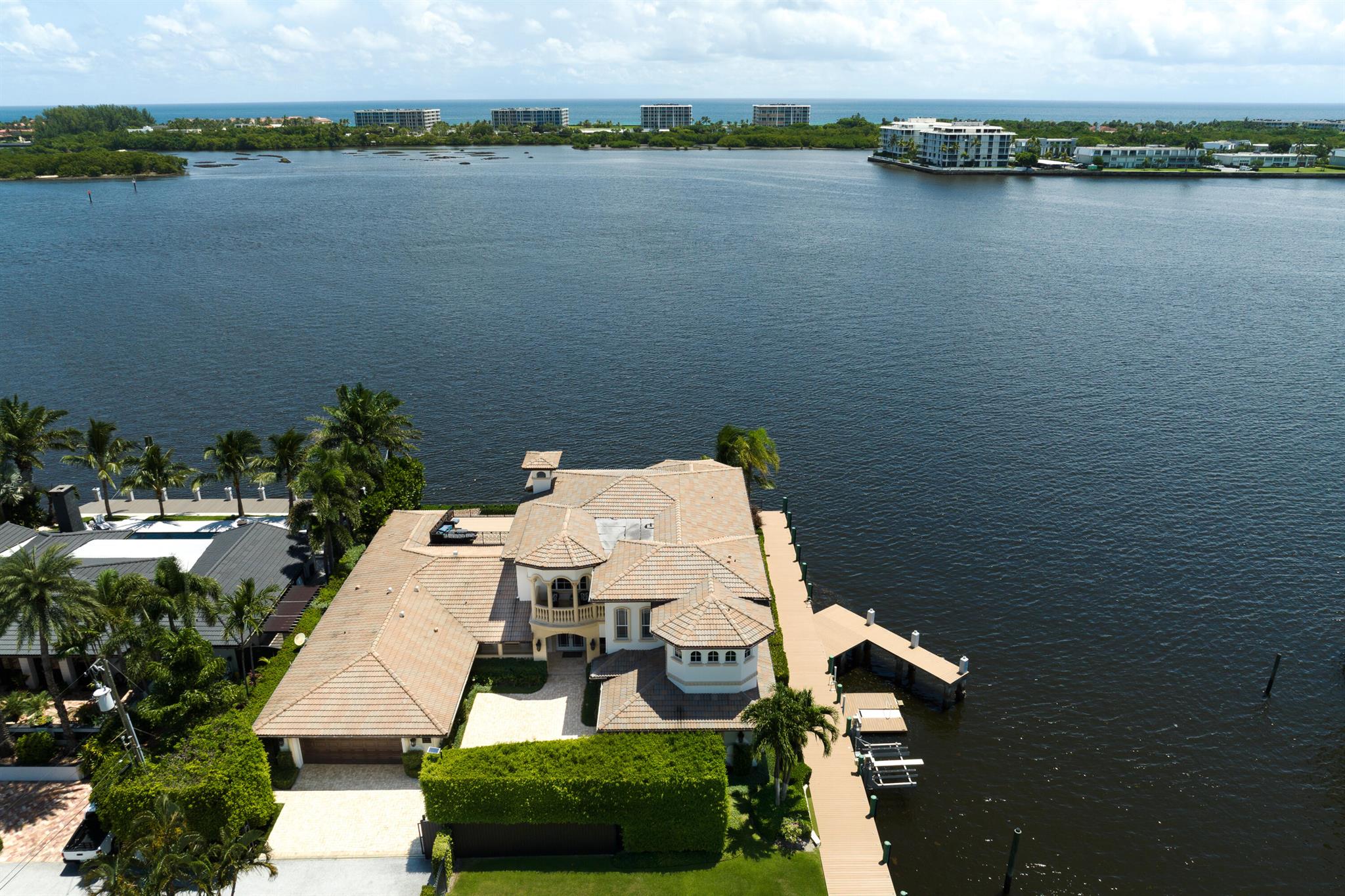 Via Mira Bella-Unequaled in South Florida.  Direct Intracoastal offering 325 ft of waterfront & 200' of dock merely 15 min to Worth Ave, One Flagler & PBI. This estate includes a primary & secondary residence affording 8300+ SF of living space surrounded on two sides by water. The Primary residence features a 17' backlit quartzite island, water's edge dining & living areas, a 5-room owners suite with panoramic vista's, & an ocean-facing rooftop terrace! Waterfront kitchens & great rooms are surpassed only by the 300' of coastal loggia's & walkways connecting the dwellings. Reimagined, the secondary residence offers its own waterfront living areas, kitchen & pool. This property offers unprecedented security & privacy & exclusive tax incentives to qualified buyers. Inquires encouraged