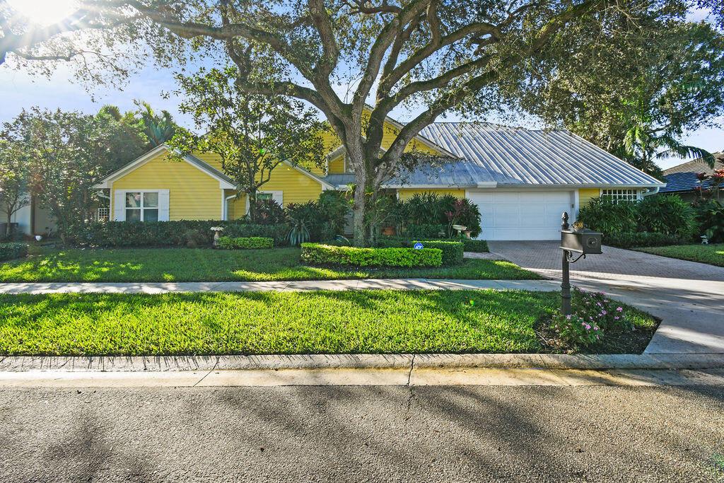SELLER MOTIVATED! This exquisite home oozes coastal charm and timeless elegance, featuring abundant pecky cypress accents and subtle nautical touches throughout. Step inside to discover a spacious living area adorned with vaulted ceilings, clever design features, and ample natural light. The gourmet kitchen is complete with custom cabinetry, built in appliances, and a center island. Retreat to the relaxing primary suite, a serene oasis with a treehouse-like balcony boasting an outdoor shower and soaking tub surrounded by tropical foliage. Additional highlights include primary suites on both floors, a Generac whole house generator (2021), and a lushly landscaped backyard with a 51' pool. Palm Harbor's 21 residences also enjoy exclusive access to a day dock on the intracoastal.