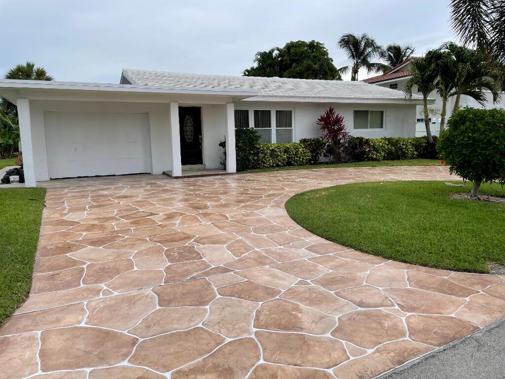 LOCATION, LOCATION, LOCATION, most sought after 100 block of Palm Beach Shores, 250' from the beach, and large 9690 sq ft lot. Stunning, recently remodeled and fully furnished, 2 Bed, 2Bath, home near the beach in Palm Beach Shores.  Welcome to your dream coastal retreat! This immaculate home offers the perfect blend of comfort, convenience & relaxation. Side area for parking a boat, jet ski or another car. Entire house features renovated kitchen, bathrooms, Pelican clean water system and clean air HEPA filter system. Large backyard with a sprawling patio with a roll up screen ideal for outdoor gatherings & entertaining. One car garage has the laundry.