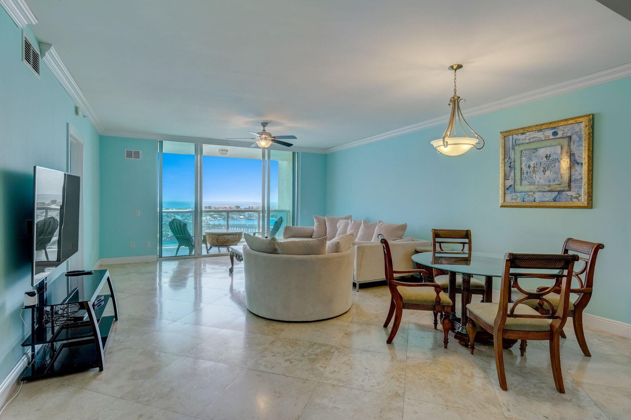 MOTIVATED SELLER!!  Spectacular intracoastal/ocean views from this 18th floor 2bd 2ba plus large den resident in the preferred ocean tower. Enjoy the morning sunrise, ocean life and the pristine blue water while sitting on your private balcony enjoying your morning coffee. This 09 model has impact 9ft floor to ceiling sliders and windows, crown moulding, travertine floors through-out (no carpet), contemporary kitchen with new counters and backsplash, master bathroom has a jacuzzi tub with a separate shower and 2 walk-in closets. MG offers a newly renovated pool deck with fireplace/bar, grills, whirlpool, glass wall that looks toward Palm Beach Island, sauna, steam room, fitness center, 4 pickleball courts, bocce ball, tennis, billiard room, card room and a
