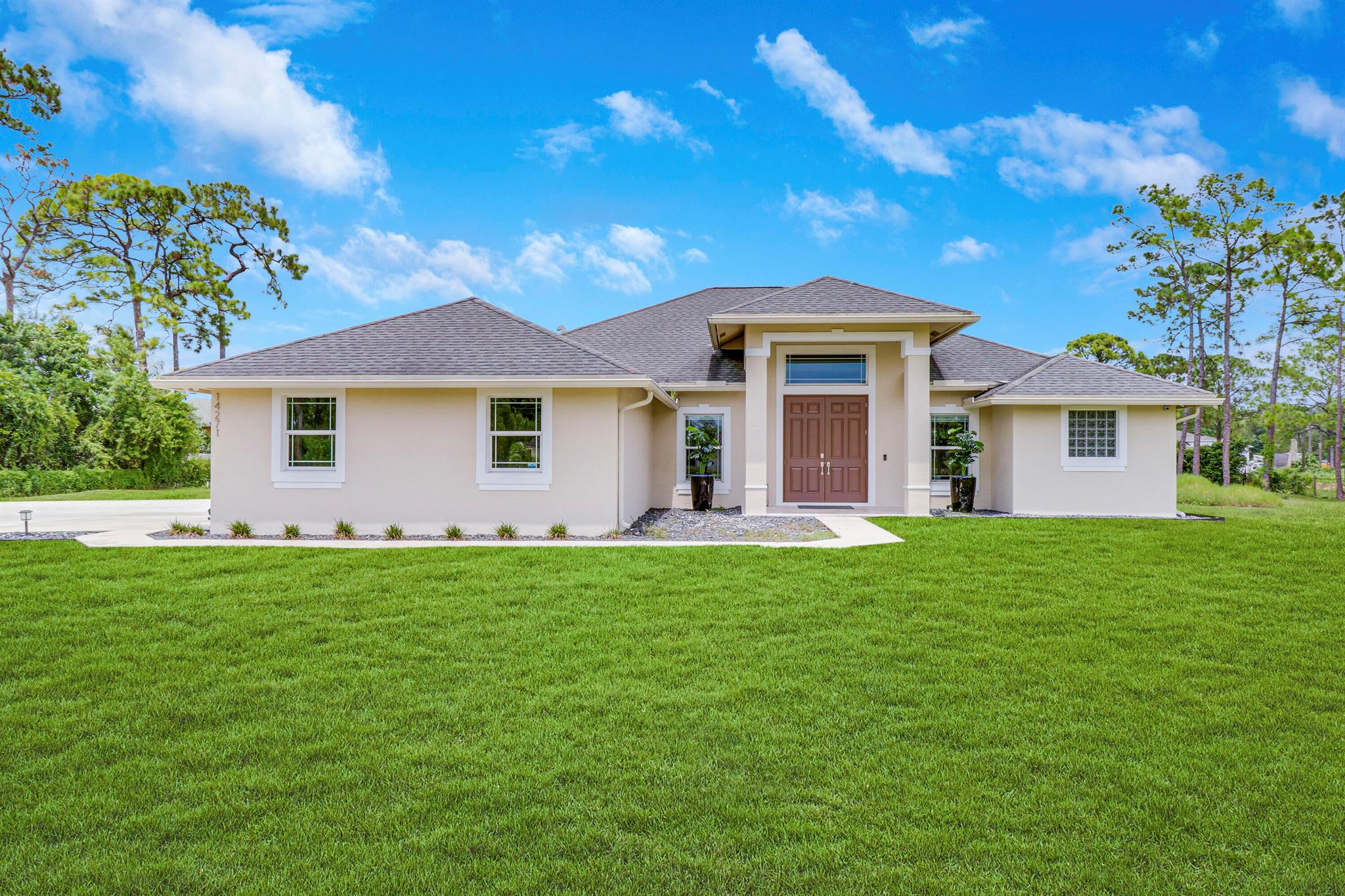 A SHOW STOPPER! Unbelievable home loaded with upgrades! This beautiful CBS home was built in 2018 and sits on over an acre of land in the heart of Loxahatchee. Walk inside to find yourself greeted with the newest trends in flooring and finishes complemented by an open floor concept perfect for entertaining. The kitchen is outfitted with beautiful dark wood cabinetry, granite throughout and upgraded with high-end stainless steel appliances with an oversized kitchen island fit for a chef! A brand new custom pool with sun deck was added in 2022 making the back yard a private tropical oasis perfect for entertaining! This home is complete with hurricane impact windows, energy efficient appliances along with a reverse osmosis system.