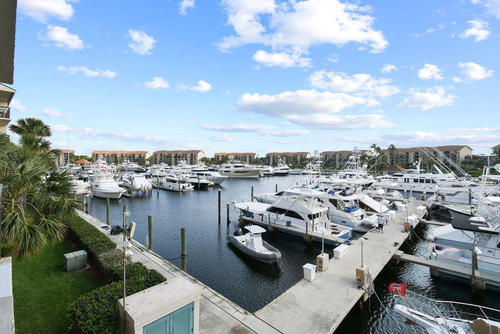 Beautiful 3rd floor corner unit with spectacular eastern views overlooking the marina and mega yachts. Updated kitchen with shiplap ceiling, light granite countertops, extra storage and stainless appliances. Hurricane impact glass sliders. Laminate flooring in the living room, dining area and bedrooms with tile in the kitchen and bathrooms. The 8 x 17 laundry/storage room has custom built-in storage cabinets with pullout drawers. Watch the sunrise from your balconies and enjoy the shade in the afternoon. Short distance to the Jupiter beaches, shopping and fine restaurants. 4 community pools, tennis, BBQ's and picnic areas. One of the best views in the entire community. Come check it out.