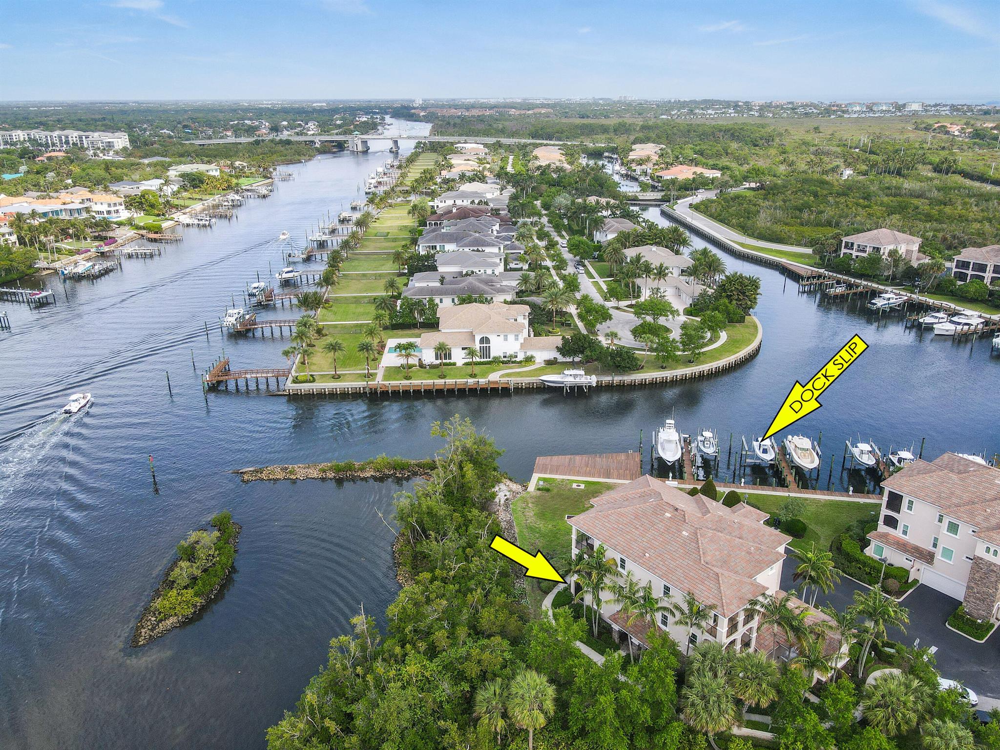 A Boater's Paradise, First Floor Carriage Home with a Private Boat Slip and Direct Intracoastal Access, nestled in the exclusive enclave of Frenchman's Harbor! Welcome to 13435 Treasure Cove Circle, where luxury living meets unparalleled maritime bliss in North Palm Beach.This ground-floor residence is located in one of the newer Carriage Home buildings, closest to the Intracoastal, and overlooking an expansive yard space with direct water views. It lives like a home with a walk out lifestyle, boasting a side entry front door, a front patio, a private back patio overlooking the water, a 2-car garage and a private driveway. Included is an exclusive-use dock slip that can accommodate up to a 60-foot vessel and houses a 20,000-pound lift, tailored perfectly for the discerning boater. The location is ideally situated for boating with a wide canal, deep water, no fixed bridges, and quick ocean access. 
Situated at the end of the cul-de-sac and oriented toward the water and lushly landscaped spaces, this carriage home has the most private views in the community and feels tucked away, like a tropical oasis. Thoughtfully designed with 3 bedrooms, 2 bathrooms, spacious living areas and opulent finishes spanning over 2,000 square feet. 
The gourmet kitchen boasts marble countertops and is equipped with a KitchenAid 6-top gas range, Fisher &amp; Paykel dual-drawer dishwasher and a large walk-in pantry. 
An expansive primary suite faces the water views, has access to the back patio and boasts a spa-like bathroom with soaking tub, walk-in shower, dual vanities, and sleek, modern finishes. Two guest suites offer the same private views of greenery and share an additional full bathroom. More home features include hurricane impact windows and doors, engineered wood flooring, expanded built-out pantry, plantation shutters, epoxy flooring in garage and a water-filtration system. 
Live like you are on vacation with this ideal floorplan that maximizes the flow of indoor sophistication and luxury outdoor living. Stepping outside onto the terrace with a drop-down screen enclosure, you can immerse yourself in the tranquil water views and ambiance or enjoy the boats going by on the Intracoastal. Mere steps away, one can walk down to their private slip and hop on the boat for a convenient day of maritime enjoyment. 
Frenchman's Harbor is an intimate, waterfront community that consists of just 48 single family homes and 30 carriage homes with a privately-manned gated entrance. The carriage homes share a community pool with grills and lounge areas, perfect for enjoying sunsets overlooking the waterways. Live walking distance to Florida's most pristine beaches with quick access to boating, water sports, fishing, fine-dining and shopping. With the Jupiter inlet a mere 15 minutes away and the crystal blue waters of the Bahamas only 50 nautical miles away, this home offers the picture-perfect Floridian lifestyle of which most people only dream!