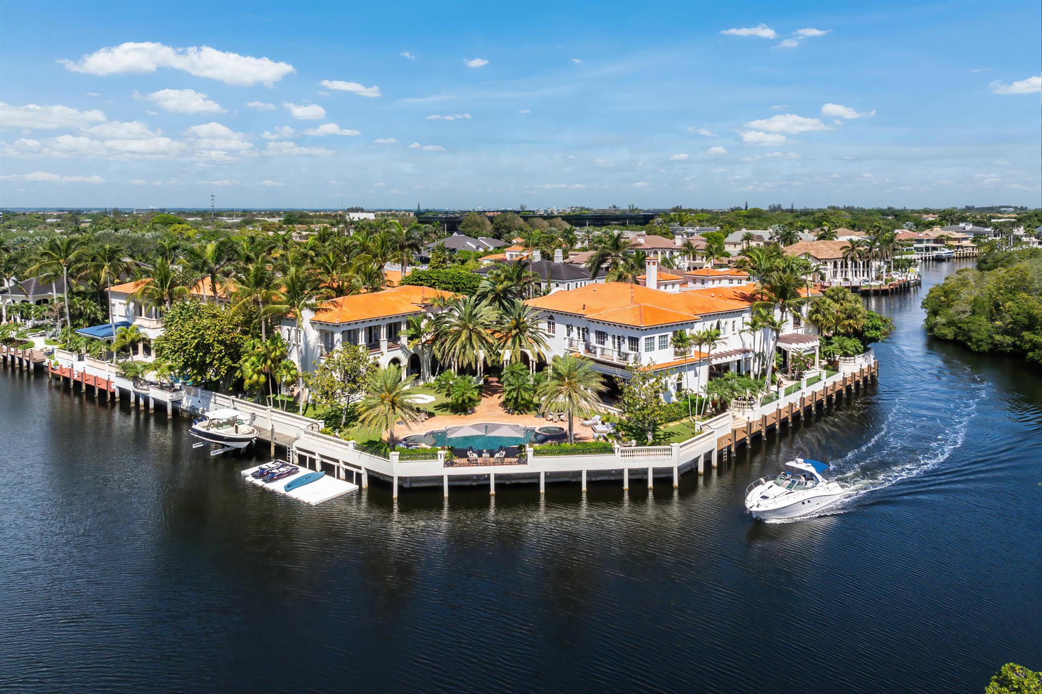 Totally updated, magnificent Mediterranean estate with 350 ft of water frontage elegantly situated on a double point lot in The Sanctuary, the most exclusive and highly sought-after luxury enclave on the Intracoastal in Boca Raton. The sprawling estate is a yachtsman dream with two deep water docks-one approx. 150' ft long,  frameless glass railings for visibility, multiple covered loggia, one with outdoor entertaining area, gas fireplace, and bocce court, impeccably manicured landscaping, and heated swimming pool. The interior of the home boasts the most exquisite finishes with fully-pocketing +12 ft sliding impact doors, high ceilings, onyx floors in bathrooms, Carrara marble kitchen counter-tops, hardwood floors, custom cabinetry. The perfect example of a wonderfully executed 3 half baths, a Skibo room with incredible wood detail, stained glass windows, wine cellar and full bar, two laundry rooms (one upstairs, one down), a captain's suite with fast access to the dock, a plentiful 5 car garage (3 doors, 2 tandem spaces), expansive master suite, library/office space, sauna. Additional features include: A bedroom has been transformed into a theater room, 2/2 Guest house with full caterer's/chef's kitchen, outdoor kitchen with top-of-the-line appliances, beautiful breezeway, automatic over-sized retractable awnings, multiple balconies facing the intracoastal, pecky cypress ceiling details, and more. The perfect example of a wonderfully executed transition between old world charm with contemporary finishes.

"The Sanctuary is a guard-gated yachting enclave featuring a 20-slip marina, 2 Har-Tru tennis courts, a multifunctional sport court, playground/park, and 27-¦-acre bird/wildlife preserve - all in the utmost seclusion with private land and water uniformed security roving patrols and concierge services.  It is listed in Forbes Top Ten Most Exclusive and Expensive Gated Communities in the United States."