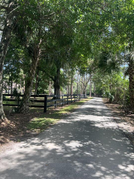 Opportunity to purchase a 5 acre fully renovated horseman's dream. Quiet country living yet minutes away from everything you need. A peaceful secluded pond surrounded by old Fl Oaks is your view from liv.rm.& loft. The 3 br 2 bath home has a large MIL suite. Bring your horses to a newly built 12 stall concrete center aisle barn w/walkouts. A 25x64 quonset hut with studio, full kitchen apt. w/d. Option to purchase Adjacent 5 ac will allow you to build your equestrian paradise or build an additional home. It also has a bldg. with 1 bedroom apt. The properties are surrounded by gorgeous trees for your privacy.