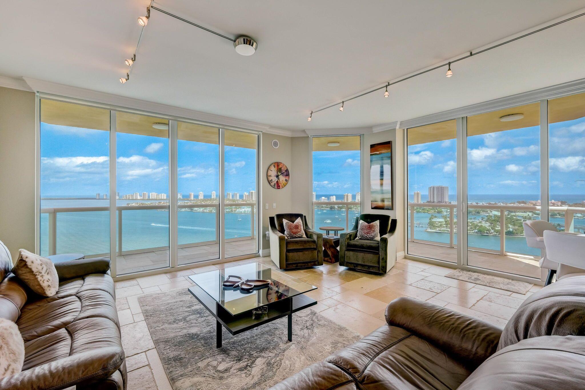 Indescribable direct intracoastal panoramic views of both the intracoastal & ocean. This custom designer home has 2594 sq ft of total living area. This 21st floor, with 3 bd 3 1/2 ba., plus den provides, French limestone floors through-out (NO CARPET) ALL custom baths, new frameless shower doors, newer AC, gorgeous custom Downsview kitchen, includes, Miele appliances, Thermador induction cooktop, new custom panel subzero refrig/freezer, wine refrig., built-in Miele coffee maker, uniquely designed marble island, 2 sets of European wood doors, crown molding throughout, Hunter Douglas remote shades, 4 1/2 inch shutter, closet organizers  in ALL closets, new Toto toilets, new washer/dryer and MUCH MORE!!This condo has been completely renovated to feel like a home in Palm Beach Island at an affordable price! In addition, Marina Grande offers the finest amenities, new pool, whirlpool, tennis courts, 4 pickleball courts, bocce ball, barbecues, fitness center with a sauna and steam room, large social room for entertaining with the community or a private party, billiard room, card room and a full-service marina adjacent to the property. Walk to the Publix across the street and a 5-10 min. walk to the beach.