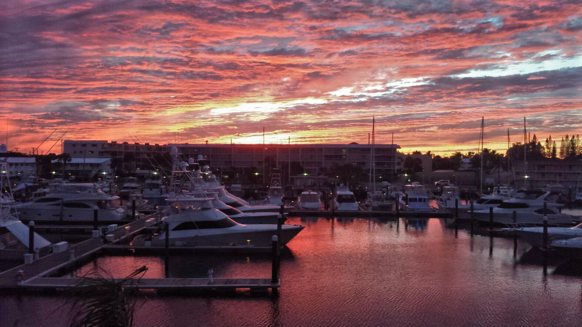 RED SKY AT NIGHT, SAILORS DELIGHT !WELCOME TO PARADISE. TOP FLOOR CONDO AFFORDS YOU CROSS BREEZES EAST TO WEST. TILE THROUGHOUT, NO CARPET. NEWER KITCHEN, BRAND NEW BATHROOM. SQUEAKY CLEAN, MOVE IN READY. OLD FLORIDA CHARM ABOUNDS IN THIS VERY WELL LANDSCAPED AND MAINTAINED BUILDING. THIS HOME OVERLOOKS THE NORTH PALM BEACH MARINA AND INTRACOASTAL WATERWAY.  BRIGHT AND BREEZY!  HEATED COMMUNITY POOL, CLUBHOUSE, PICNIC AREA WITH BBQ GRILLS. BOAT DOCKS OUT BACK TO 28 FT, FIRST COME FIRST SERVE. ENJOY SOME FISHING OFF THE DOCK AT YOUR LEISURE. A SHORT WALK TO NPB COUNTRY CLUB WHERE YOU CAN ENJOY A ROUND OF GOLF. FABULOUS SHOPPING , RESTURANTS AND BEACHES SO CLOSE BY. CASUAL RESORT STYLE LIVING AT A VERY AFFORDABLE PRICE!  YOU WILL ABSOLUTELY LOVE LIVING HERE! PET FRIENDLY,ALL AGES WELCOME