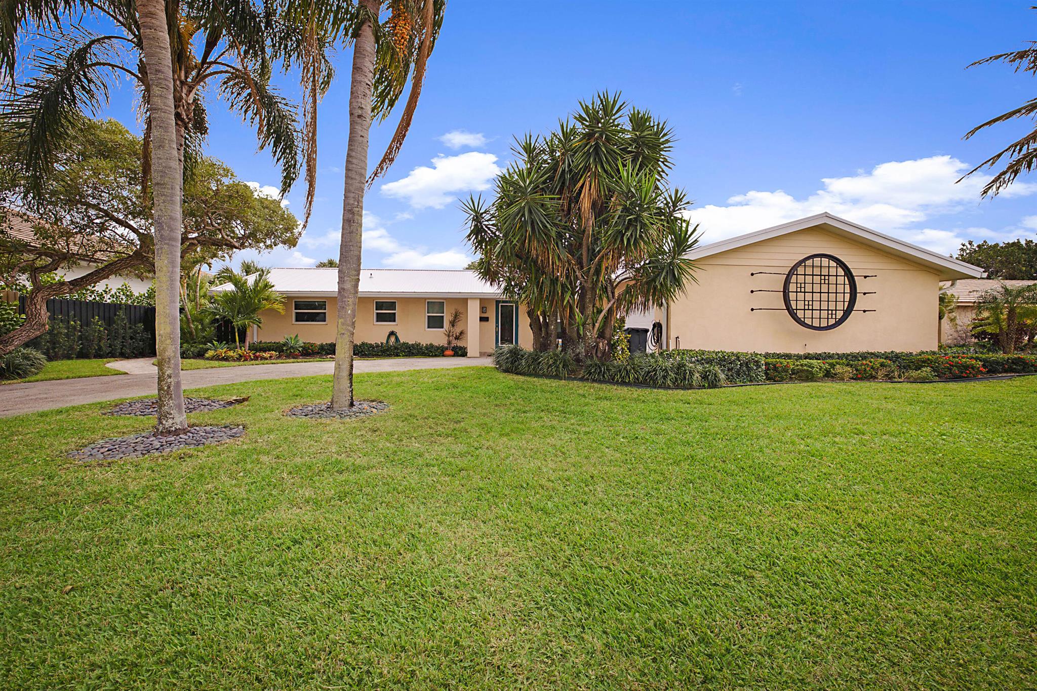 Come see this Mid-Century modern three bedroom, three bath, pool home in the much sought after Yacht Club Village, North Palm Beach. Brought down to the studs and completely renovated in 2019, including new roof, impact glass throughout, new plumbing and electrical wiring. The home offers a split floor plan where each  bedroom has its own bath en-suite. Open kitchen with large island, GE Profile appliances-gas cooktop, wall oven and microwave. Solid core doors throughout, including closets. Great location and just a short walk to Lakeside Park.