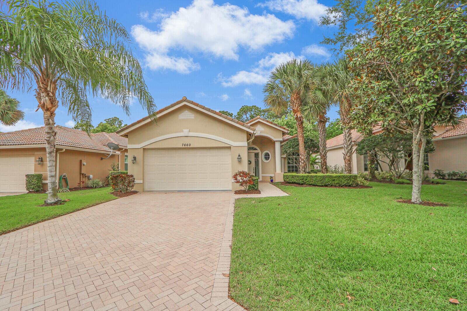 WINNING COMBINATION!!!  The ever popular FAIRVIEW floor plan in the highly sought after GREENBRIER neighborhood, in the heart of PGA Village!  This is a true 3 br, 2 bath with tile throughout and brand new carpet in the master, A/C is only 3 years old, crown moldings, neutral decor & nice finishes!  Screened lanai backing to private treed yard.  Vacant and available for immediate occupancy.  Close to The Legacy Golf & Tennis Club, close to the PGA Golf Club & it's 3 world class championship golf courses, close to the gate, away from the 1-95 & a short ride to the Island Club, the community club house with pool, fitness center, tennis, pickle ball, card rooms, catering kitchen & a full calendar of events & activities, something for everyone!