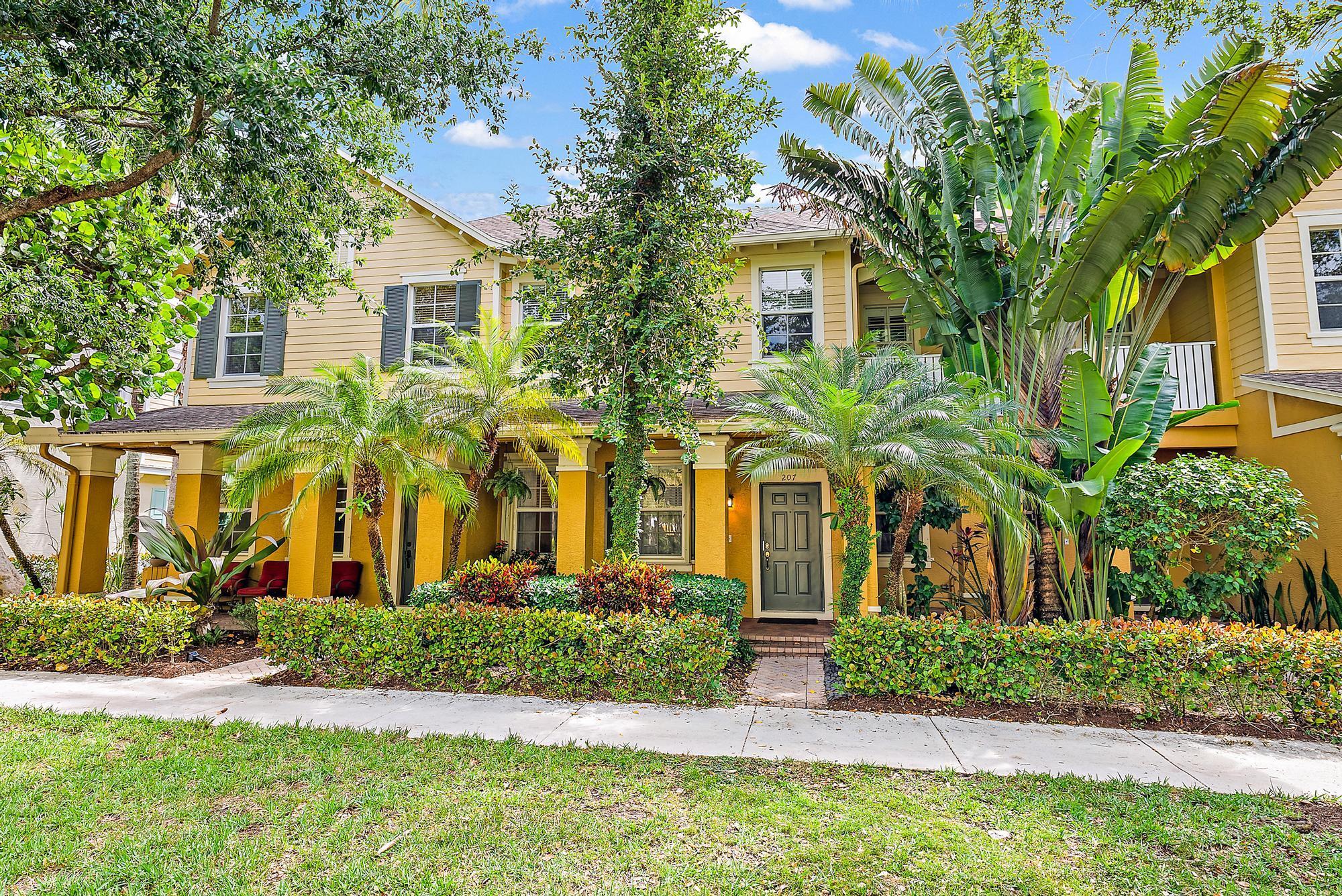 Welcome to your CHARMING 2-story townhouse in Botanica, Jupiter: MOVE-IN ready with prime PRIVACY and many amenities. This SPACIOUS 1,507 sqft home features 3 bedrooms, 2 full baths, and 1 half bath, offering comfort and style in a prime location.Step inside and discover a THOUGHTFULLY designed layout. The first floor welcomes you with a bright and airy living room/dining area, perfect for relaxing or entertaining. The kitchen, featuring wood cabinets and granite countertops, overlooks the OPEN and FENCED patio in the back, creating a seamless indoor-outdoor living experience.Ascend the stairs to the second floor, where you'll find the primary/master bedroom and two guest bedrooms.