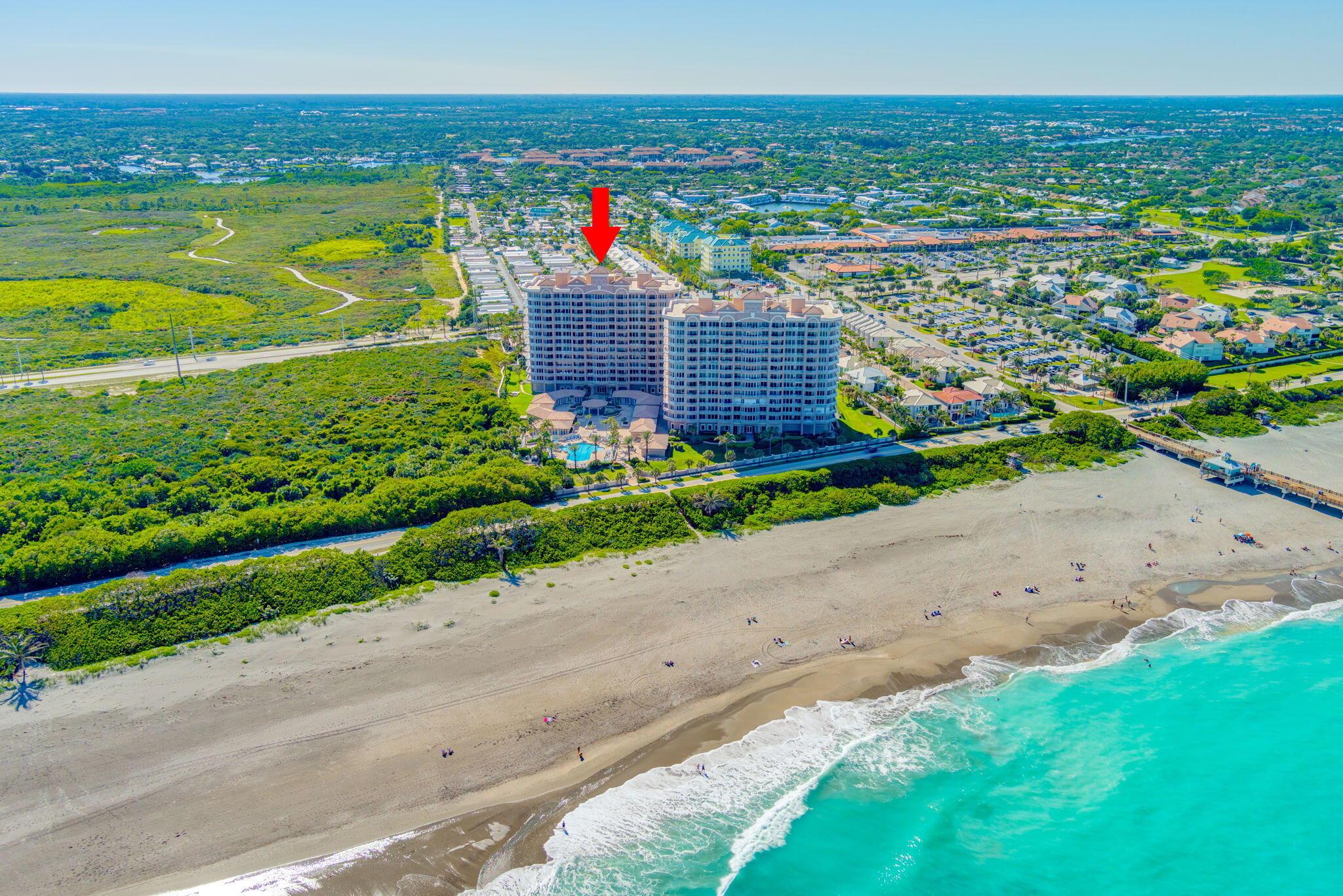 Step into the epitome of luxury beachfront living at Ocean Royale in Juno Beach. This second-floor northeast corner unit offers nearly 3000 square feet of living space, with a balcony that wraps around the entire unit. Boasting 3 bedrooms, 3.5 baths, and 2 under-building garage spaces, this residence sets the standard for upscale coastal living. Beyond the 24/7 manned gate and concierge service, an array of amenities awaits, including a sprawling resort pool, state-of-the-art fitness center, golf simulator facilities, a/c bike/paddleboardoard  storage, billiards room, theater room, pickleball/tennis courts. Just steps away, you'll find yourself immersed in the world-class beaches, along with the beloved Jupiter dog beach. Don't miss the opportunity to experience the unparalleled lifestyle