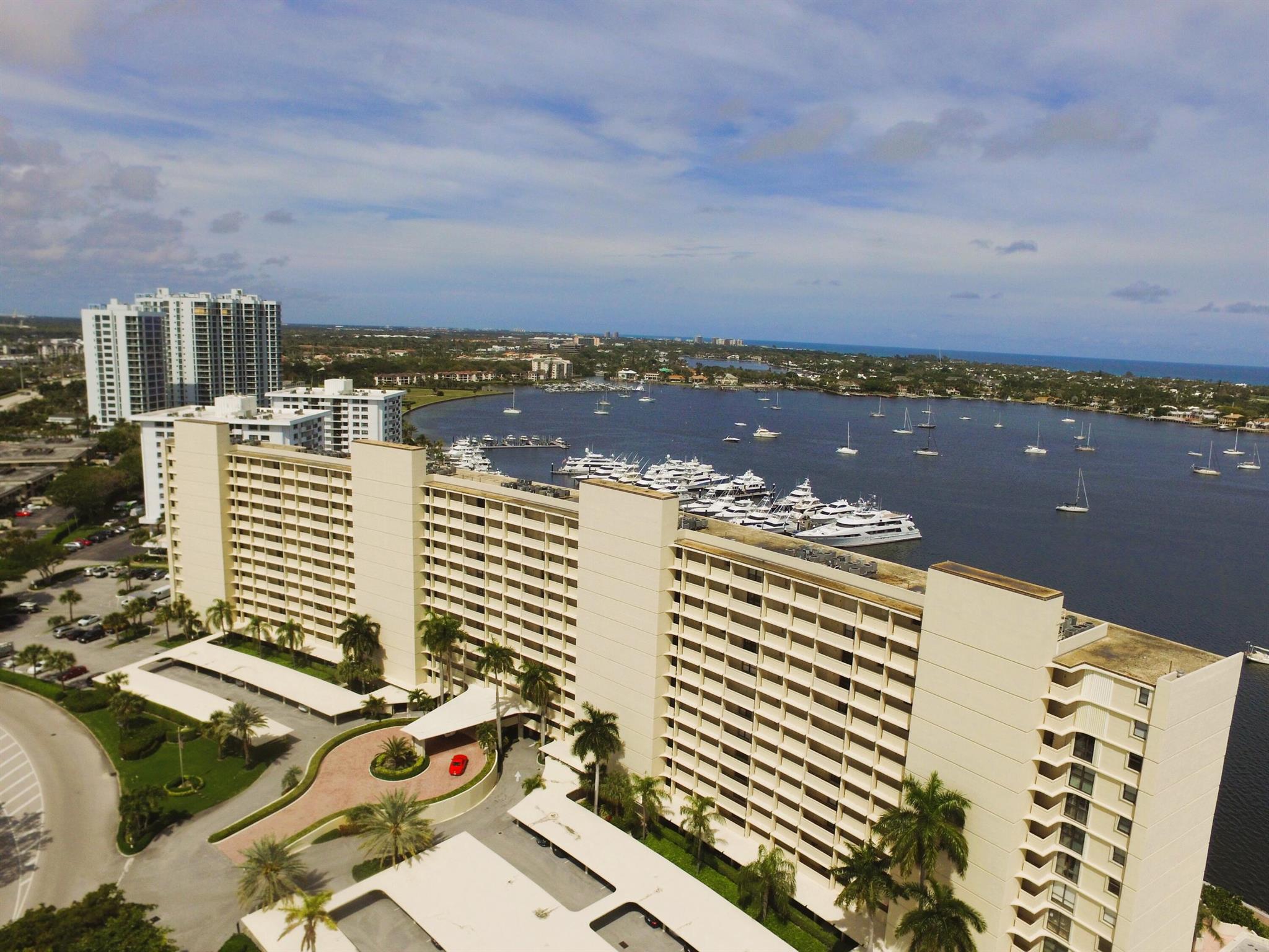 WOW - Rare 3/2.5 with awesome views, Tile Floors throughout all living areas & bedrooms, Each Bedroom has a stunning view of the Intracoastal Waterway, Mega Yachts & the Ocean beyond. The location of this condo convenient to everything in the Palm Beaches (golf & tennis, beaches, airport & more). A private marina available for residents to use, shopping just across the street. Belle's Bar and Grill, a members-only restaurant located on site, Nice Pool, fitness area, 2 mile walking path & more..