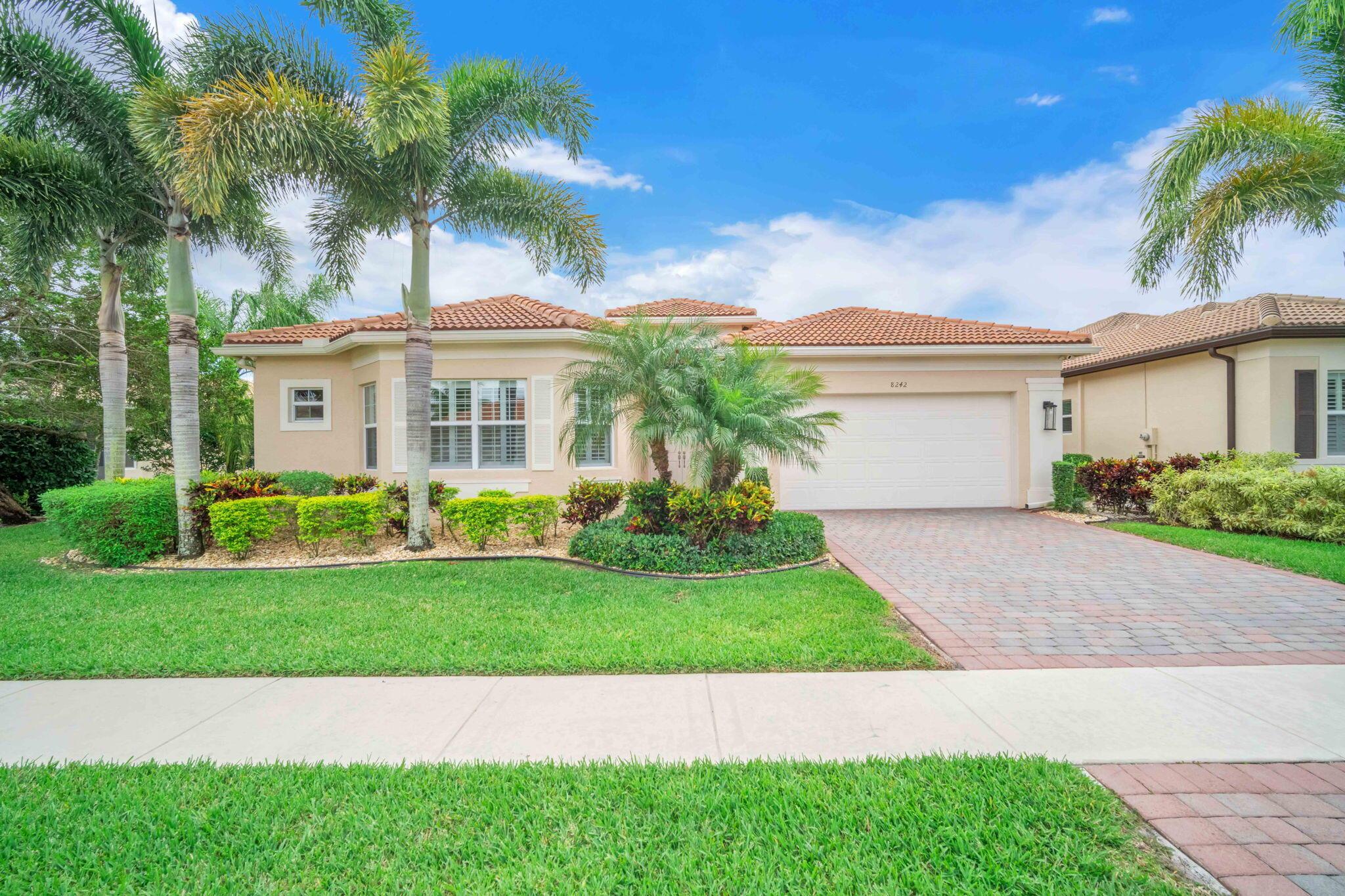 Wow! Gorgeous lake view.  Expanded patio with dome, picture window screen & a southern exposure.  This 2 bedroom plus den, 3 bath home was a vacation home and barely lived in.  Stunning wood-look porcelain tile flooring, huge pantry with pullouts through out the kitchen & bathrooms.  Exterior custom lighting.  Many more upgrades.  Valencia Cove is an extremely active 55+ community offering a multitude of activities for all.