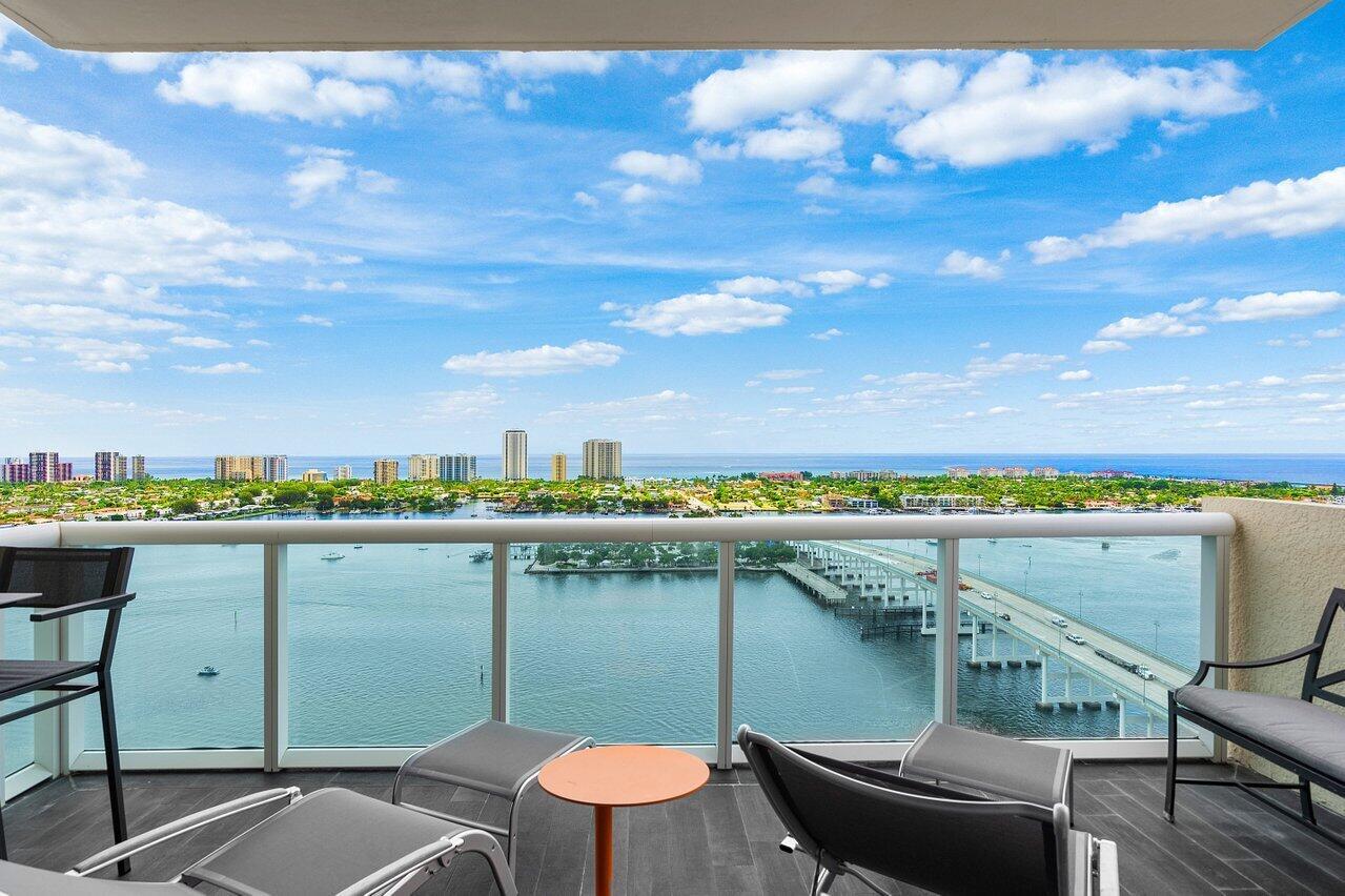 Rare Penthouse Seasonal Rental! Panoramic 26th floor Intracoastal & ocean views! Immaculate 2BR+den/2BA condo w/impact glass, Open concept w/spacious great room, dining/den, fabulous modern granite kitchen w/stainless appliances, split floor plan, & semi-private elevator access. Spacious owner suite w/his & her walk-in closets. Assigned parking in covered parking garage & climate-controlled storage unit. 24/7 manned gate, valet, tennis, pickleball, walking path w/gazebo, Newly remodeled covered rooftop oasis w/pool, spa, BBQ areas. Clubhouse, billiard room & fitness center. Marina w/dry docks available. Adjacent dry docks may be available so jump on your boat effortlessly & be on the ocean in minutes; no fixed bridges! Minutes to nationally ranked snorkeling/diving at Blue Heron Bridge