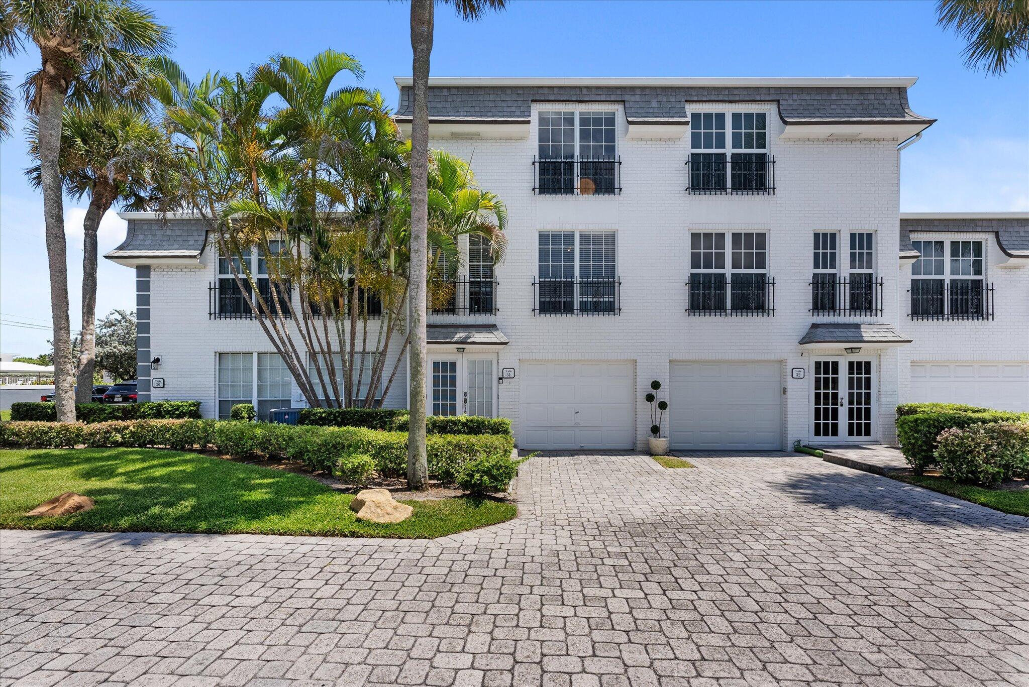 Located in prestigious Hillsboro Mile at the exclusive Hillsboro Beach and Yacht Club, this beautifully maintained three story townhome with attached one car garage is not to be missed! Remodeled kitchen with stainless steel appliances. Third floor consists of two primary bedrooms & baths w/walk-in closets. Second floor has expansive living area with a formal dining room, bathroom, and large eat-in kitchen. First floor has a large private room forguest/office/theatre with bathroom/shower and sliding glass doors to covered patio. Plantation shutters throughout. Community offers access to private beach!, tranquil pool, hot tub, & tennis court. Boat dockage available with access to Intracoastal. Come and wake up everyday in a vacation!