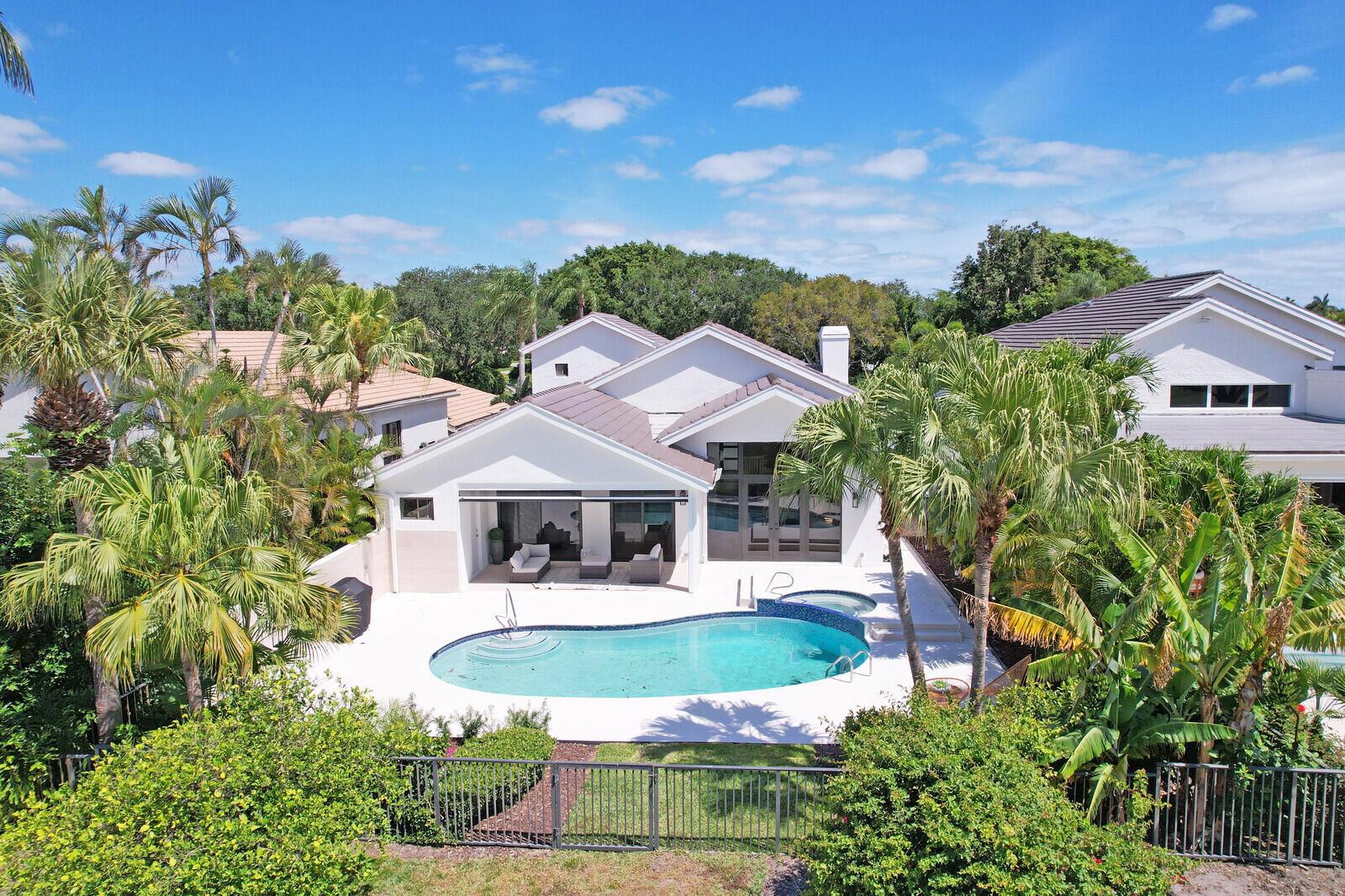 Completely renovated gem, including a new roof, in Frenchman's Creek.  Stunning views of the golf course. Primary suite is on the first floor with his and her baths. Beautiful pool /spa with  remote patio screens