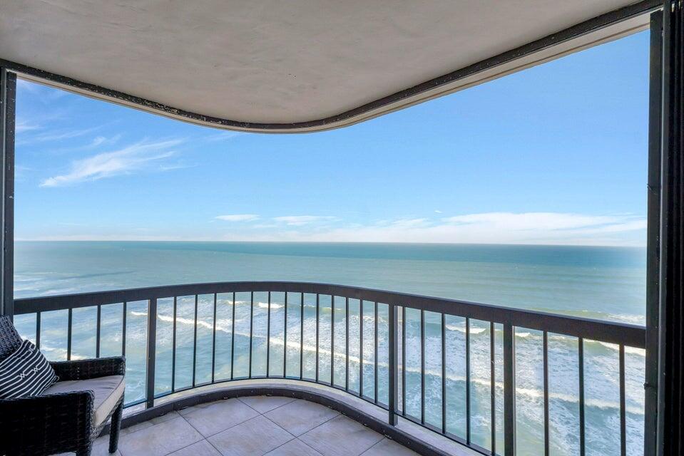 :THE MOST GORGEOUS VIEW OF THE BLUE ATLANTIC OCEAN FROM BOTH OF YOUR WRAP AROUND BALCONIES DIRECTLY OVER THE OCEAN.1 BALCONY FACES SE AND THE OTHER FACES NE. FLOOR TO CEILING IMPACT WINDOWS, UPGRADED KITCHEN WITH ELEGANT FINE WOOD CABINETRY, AND 3 UPGRADED BATHROOMS MAKES THIS 3 BEDROOM 3 BATHROOM UNIT 1 OF A KIND.WASHER AND DRYER IN UNIT. GARAGE PARKING,HEATED POOL,JACUZZI , BBQ AREA, STATE OF THE ART FITNESS CENTER, HIS AND HERS SAUNA, BILLIARD ROOM, 24 HOUR CONCIERGE SERVICE, MANED SECURITY GUARD GATE, LIBRARY, OCEAN LOUNGE WITH FULL KITCHEN, AND MOST IMPORTANT 700 FEET OF SANDY BEACH AT YOUR FOOTSTEPS.