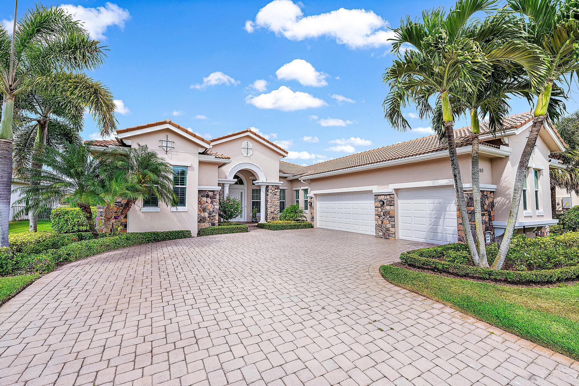 Prepare to be captivated by this exquisite residence in Jupiter Country Club, set against the backdrop of breathtaking golf and lake views.As you step into this remarkable home, you'll be greeted by an elegant seating room designed for entertaining with large open windows and the backyard as your conversation piece. The well-appointed gourmet kitchen leaves no detail overlooked featuring a hooded gas range, custom backsplash, center island, and spacious pantry. This culinary haven is perfectly complemented by a sunlit breakfast area and an expansive family room. Sliding glass doors seamlessly connect the indoor and outdoor living spaces, providing direct access to the covered lanai, where alfresco dining and relaxation await. a serene sitting area with a bay window, coffered ceiling, and two walk-in closets. The opulent master bath beckons with his-and-her vanities, a Roman tub, separate shower, and a private water closet.
This exceptional home further boasts three guest bedrooms, three additional full baths including a full cabana bath for added convenience. A private study with double doors offers a quiet space for work or reflection, while a separate laundry room ensures practicality. A three-car courtyard garage provides ample space for vehicles and storage while adding to the grandeur of the property.
Experience the unparalleled lifestyle of Jupiter Country Club, where luxury meets tranquility in an exclusive golf community. Schedule your visit today and discover the unmatched elegance and sophistication of this best-selling extended Castania model.