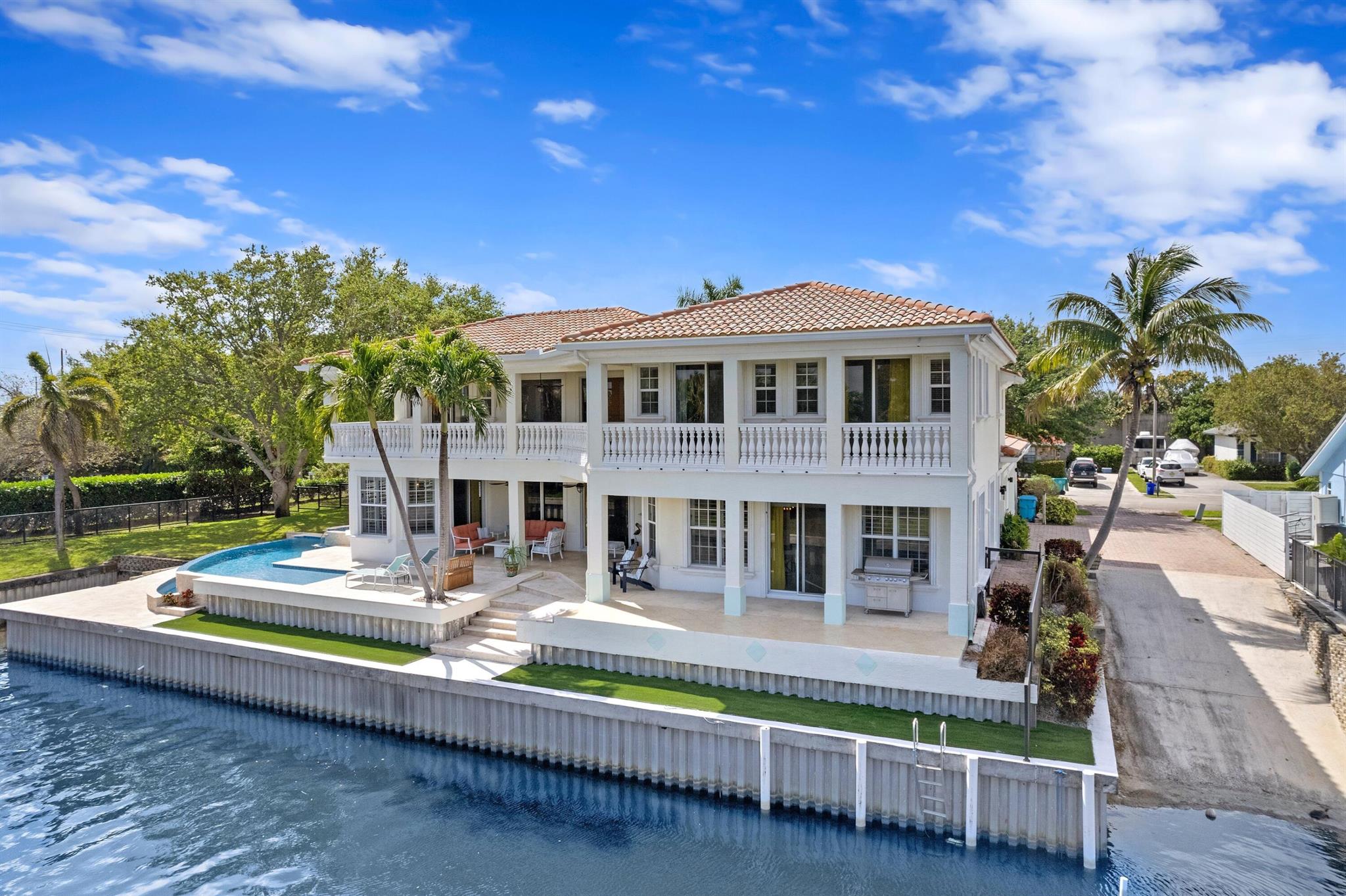 GORGEOUS & PRISTINE CUSTOM BUILT WATERFRONT ESTATE! SPECTACULAR LAKE IDA+LAKE EDEN+ WIDE CANAL WATERVIEWS | PRIVATE DOCK & BOAT RAMP | 120' WATERFRONT | 1/2 ACRE CORNER LOT | 3 Miles to Beach + Downtown Delray Atlantic Ave |  HIGH-END MATERIALS & SUPERIOR CRAFTSMENSHIP | 5 Bed Ensuite | 4.1Bath | Spectacular 1st Floor Master Ensuite with All Water Views | Huge Ceiling Heights | Bright Open Floorplan | Gourmet Chefs Kitchen, High-End S/S Appl, Gas Stove, Quartz Counters, Center Islands/Bar | Natural Wood/Porcelain Tile | Floor to Ceiling Windows/Doors | All Hurricane Impact Complete | Plantation Shutters | New 2022 Infinity Salt Water Pool & Jacuzzi, Waterfall | Travertine Wrap-Around Waterview Patio & Balcony | 2+Car GA | RV/Boat Parking | Huge Game Room | So Much More!