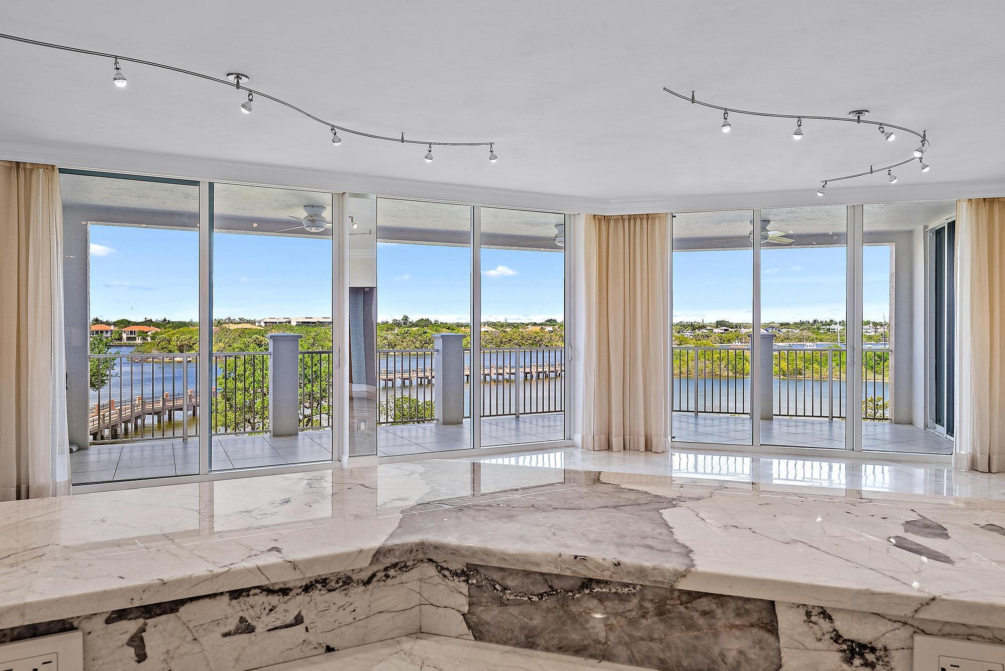 This very sought after Garwood model in the Anchorage Building at the prestigious Jupiter Yacht Club, features a den in addition to the primary suite and the two guest bedrooms. The den could be an office or serve as a fourth bedroom! This is also the floorplan with the largest, open-layout kitchen. North-west exposure with captivating views of the Intracoastal waterway and sensational sunsets. Residents of the Anchorage Building have exclusive access to first class amenities incl. a heated salt-water pool, poolside summer kitchen, a gym, a social room, a movie theatre, a library, a gated dog park, a manned front gate and two garage spaces. Boat slips in the protected JYC Marina can be leased or purchased. The Jupiter Yacht Club retains the value of peaceful living, while being convenient