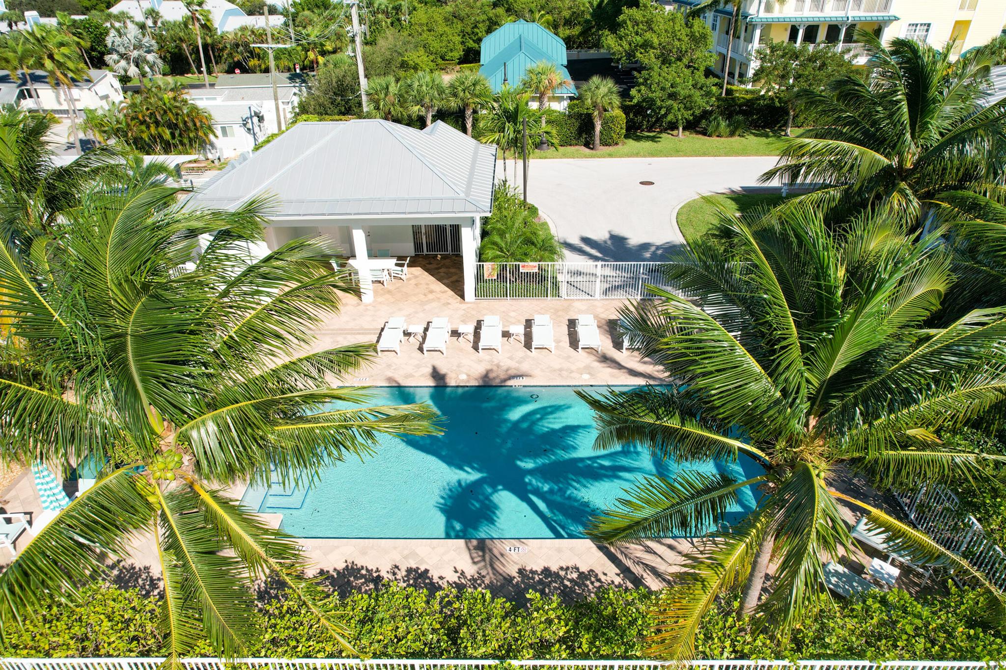 Just steps from the ocean and Juno Beach Pier, this modern Key West style townhome built in 2017 boasts high ceilings, 3 bedrooms, 2.5 baths, 2 car garage, metal roof, impact windows and doors, plantation shutters, designer upgrades and much more. The developer installed special soundproofing material within the walls to provide the comfort of a single family home. Ideally positioned within this charming community of Ocean Breeze with a total of only 24 homes and community pool - enjoy the lifestyle that only Juno Beach & Jupiter can offer!