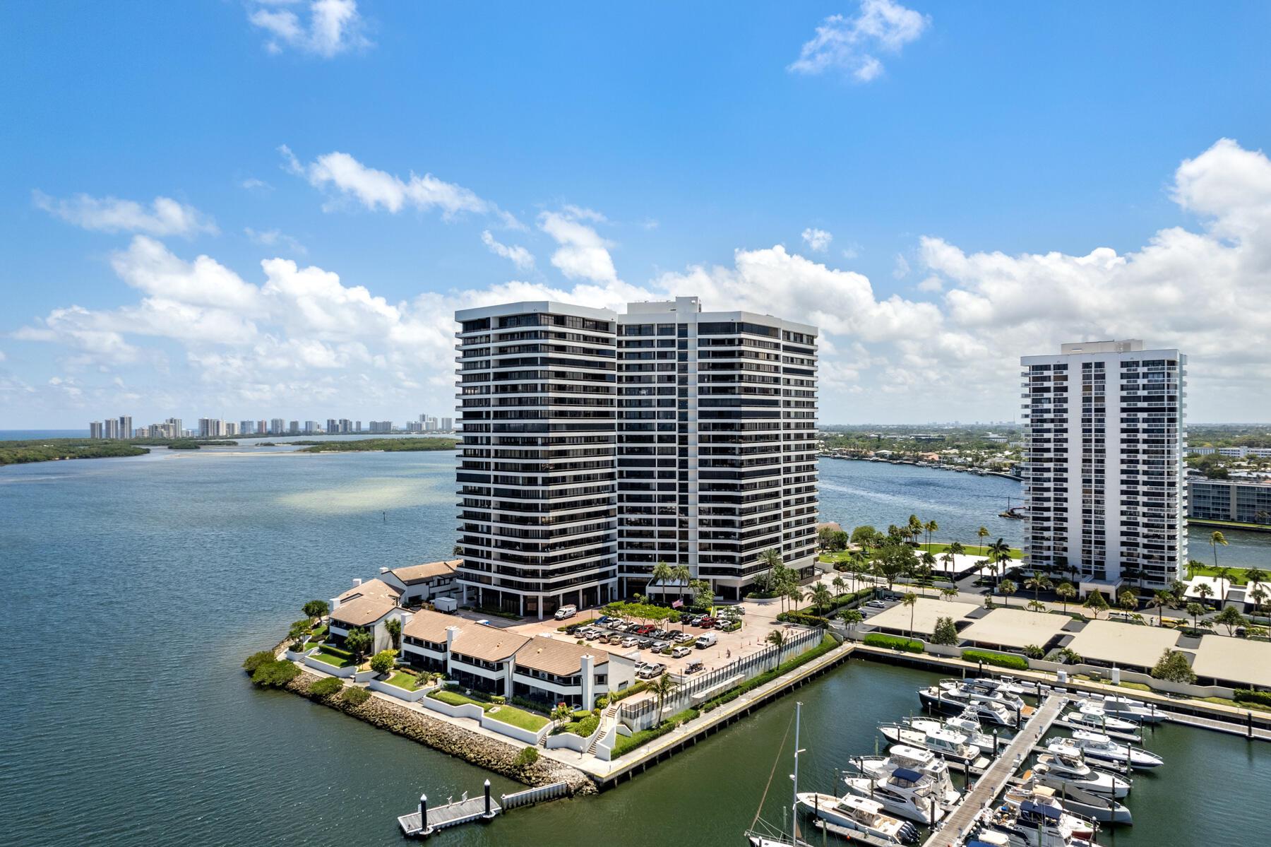 OLD PORT COVE PENTHOUSE RARE OPPERTUNITY to acquire a SUPURB view and location in a contemporary North Palm Beach building. Sizzling view of ocean and wide intracoastal waterway with southeast exposure. Large split 2 bedroom design allows for a 9X8 convenient/stylish in-home office. Live outside on an unusually large 12. foot deep and 21-foot-long balcony, This residence has 10'8'' ceilings with complete laundry room, travertine floors throughout, Subzero and Thermador appliances, wood cabinets and granite counter tops, extra storage, garage parking and MORE! Common areas are in the process of being updated. The 2 mile marina/ intracoastal walkway allows an easy walk to an onsite waterfront restaurant and bar.Old Port Cove is located conveniently in the center of everything.