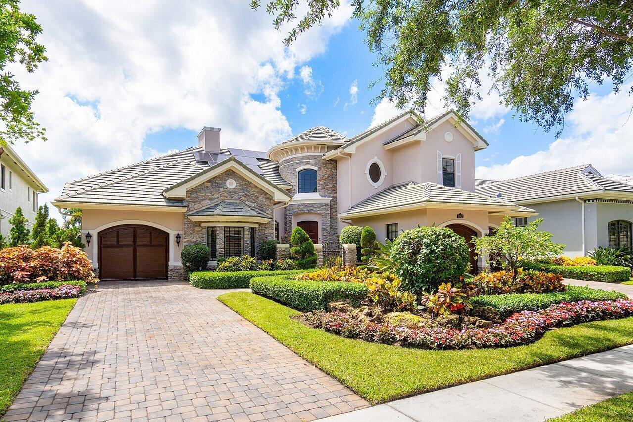 This exquisite estate home is nestled in one of the most sought-after, affluent communities in Palm Beach County. This home offers a tranquil and private retreat with breathtaking views of the pool, spa, and sprawling backyard, complete with a serene nature preserve backdrop.Step into luxury as you enter through the grand circular foyer, where soaring ceilings and elegant marble floors greet you. At the heart of the home, a stately stone fireplace exudes timeless elegance. Its intricate details captivate, inviting you to gather 'round and savor the warmth of crackling flames.The open-concept layout seamlessly connects the formal living room, dining room, and chef's kitchen, adorned with top-of-the-line European cabinetry, center island with prep sink, Taj Mahal quartz countertops, prep sink, Taj Mahal quartz countertops, high-end light fixtures, pure snow glass backsplash, French gold accents, as well as high-end stainless-steel appliances including a raised dishwasher, oversized refrigerator, double oven, raised dishwasher, and a five-burner natural gas range.

Entertain guests in style with a custom bar, spacious family room, and breakfast nook overlooking the pool. The main floor also features an office (or potential bedroom) with hardwood floors, coffered ceiling and plantation shutters, while the oversized master suite boasts wood floors, double tray ceilings, and dual walk-in closets, as well as his and hers separate ensuite bathrooms. Indulge in spa-like luxury in the master bathrooms, featuring marble floors, glass showers, upgraded vanities with quartz countertops, and a soaking tub. 

As you ascend the spiraling staircase upstairs, you will see the perfect retreat for guests or children. The large, versatile loft which could be easily converted into another bedroom, offers additional living or sleeping quarters. On either side of the loft are well-appointed bedrooms each with ensuite bathrooms. The rooms are all light and airy with plenty of space. 

Outside, the resort-style amenities continue with a heated saltwater pool, spa, and covered lanai with a built-in natural gas grill. Professionally landscaped grounds, custom outdoor lighting, and a full-house Generac generator add to the allure of this exceptional property. Rest assured you will never miss a moment of electricity in storms! Hurricane impact windows on the front of the house, and hurricane shutters in the rear of the home provide peace of mind in any storm.

You will see extremely low electric bills due to solar powered savings. With a low monthly solar payment, your electric bills should be cut in more than half throughout your entire ownership. Ask for details on this incredible savings!

Enjoy the exclusive amenities of the Equus community, including a clubhouse, tennis courts, playground, and fitness center, along with access to the Equus Equestrian Center for horse enthusiasts. With its prime location near top-rated schools, shopping, dining, and the beach, this estate offers the perfect blend of luxury, comfort, and convenience.

The HOA fees for Equus include your cable with three HD receivers, premium channels, internet, home phone with unlimited domestic calling, alarm monitoring, common area maintenance, manned gate, all the amenities, and the on-site manager. An excellent value!

Don't miss the opportunity to make this your next home! 

View the video in the pictures section!
