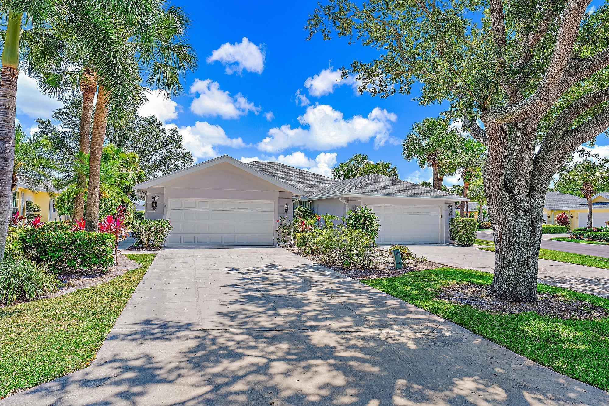 BACK ON THE MARKET DUE TO BUYER'S DEFAULT. Welcome Home! Experience the joy of coastal living at an affordable price, nestled on the 11th hole of a pristine golf course. This 2 bedroom, 2 bathroom townhome offers the perfect blend of practical and prestigious, boasting breathtaking views of lush greens and serene fairways from your very own back porch. Enjoy 1,525 of living square feet in this Divosta Extended Capri model that includes a full-sized 2 car garage and a covered screened porch. Full hurricane protection with ACCORDION SHUTTERS gives you one of the most reasonable insurance rates in the area. Newer appliances and built-in closets make this unit hard to pass up. HOA fees include cable/internet, lawn care & roof maintenance, making this a turnkey lifestyle solution. Recent upgrades include: 2022 Roof, 2023 Carpet and 2023 Water Heater.

Located just minutes from the beach, Jupiter's A-rated schools, Roger Dean Stadium, and countless restaurants and activities, this property won't last long!