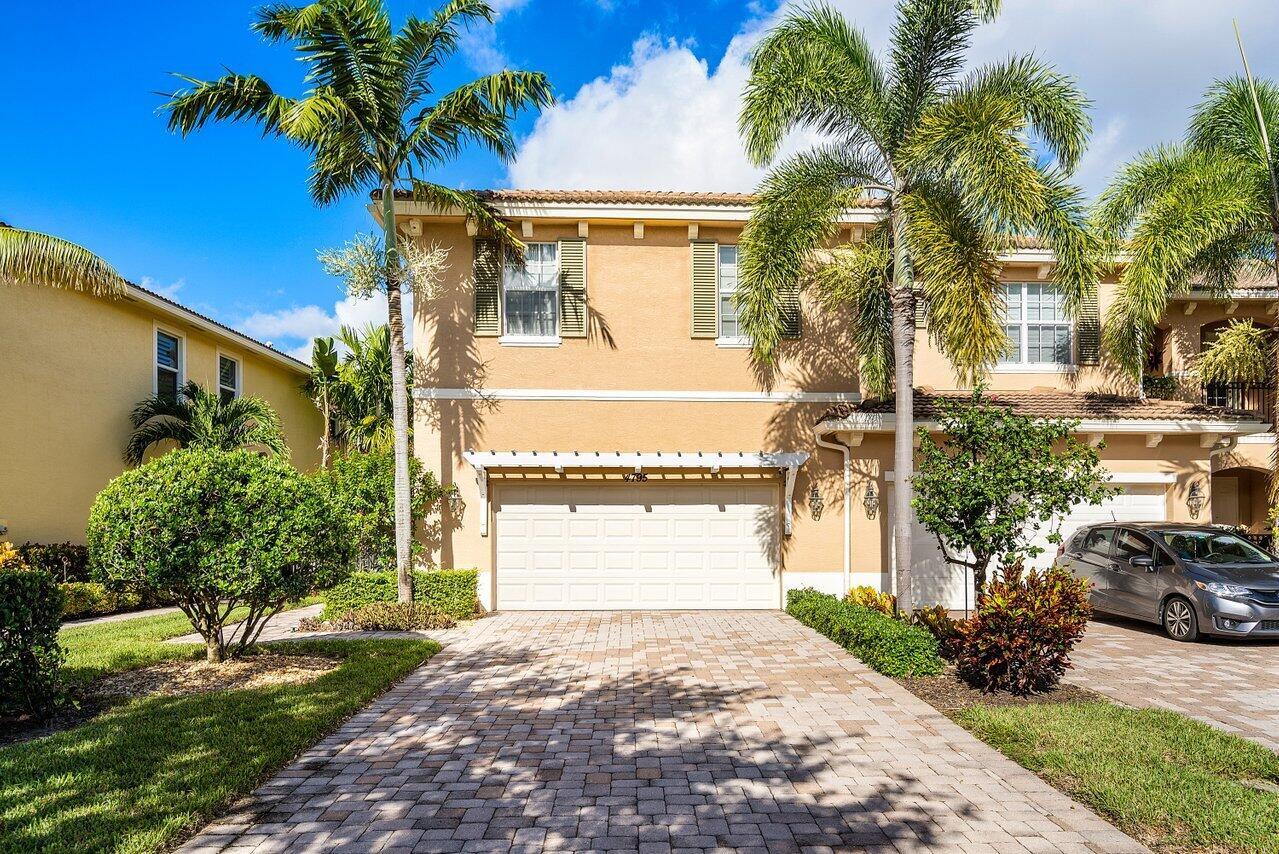 This stunning townhouse in Palm Beach Gardens offers a perfect blend of modern living and serene outdoor spaces. The spacious layout features 3 bedrooms plus a versatile loft, ideal for a home office or additional living space, and 2.5 well-appointed bathrooms within 2021 square feet of living space.The property is in mint condition and boasts upgrades including elegant plantation shutters and modern appliances, enhancing kitchen experience. The oversized patio, surrounded by mature landscaping, provides a private oasis perfect for entertaining or unwinding after a long day. An oversized 2-car garage offers ample storage and parking space.Located within a secure gated community, residents have access to a beautiful pool, ideal for leisurely swims and social gatherings.