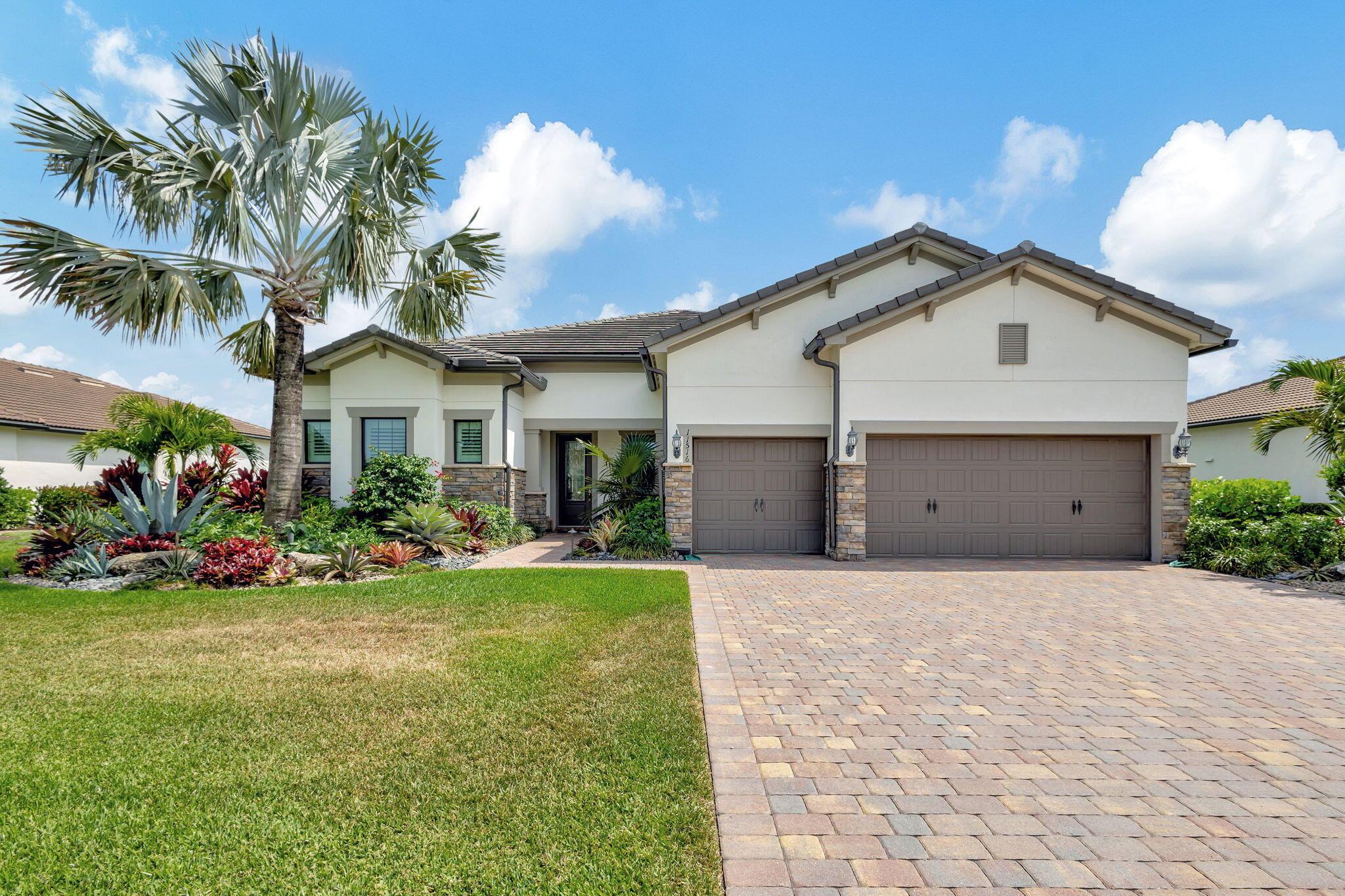 Step into Luxury Florida Living in this Exquisite Waterfront Home that Epitomizes both Elegance & Comfort. This beautifully appointed residence boasts a Spacious Open Floor Plan with an Abundance of Natural Light and Coffered Ceilings perfect for Entertaining. A Chef inspired Gourmet Kitchen includes Top of the Line Stainless Steel Kitchen Aid Appliances and Stylish Designer Cabinetry. Spend endless hours of Seamless Indoor/Outdoor Enjoyment complete with High End Custom Pool, Zero Corner Sliders, Summer Kitchen & Bar, Screened Lanai and a Peaceful Waterview. Includes Whole House Generator, Storm Smart Hurricane Screens, Full Impact Windows & Doors for added peace of mind. Maintained beautifully by Original Owners, Please See Documents for a Complete List of Timeless Finishes