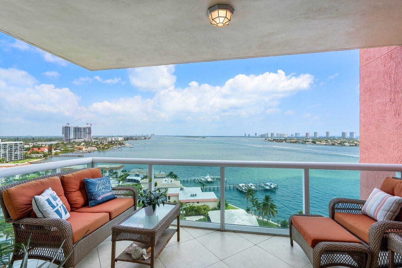Beautifully updated 14th floor END UNIT w/2BR + den, 2BA overlooking the Intracoastal, impact glass, semi-private elevator access. Open concept, split floor plan with spacious owners suite w/his & her walk-in closets. Amazing primary bathroom with large walk in shower, glass enclosure, modern finishes with a spa like feel! New Doors throughout, neutral paint and fully tiled. plantation shutters and a new A/C unit!  Assigned garage parking & climate-controlled storage unit. 24/7 manned gate, valet, NEW tennis, NEW pickleball, walking path w/gazebo, Newly renovated rooftop oasis w/pool, spa, BBQ areas, clubhouse, billiard room & fitness center. Marina w/dry docks available. Jump on your boat effortlessly & be on the ocean in minutes; no fixed bridges! Pet friendly and social community.