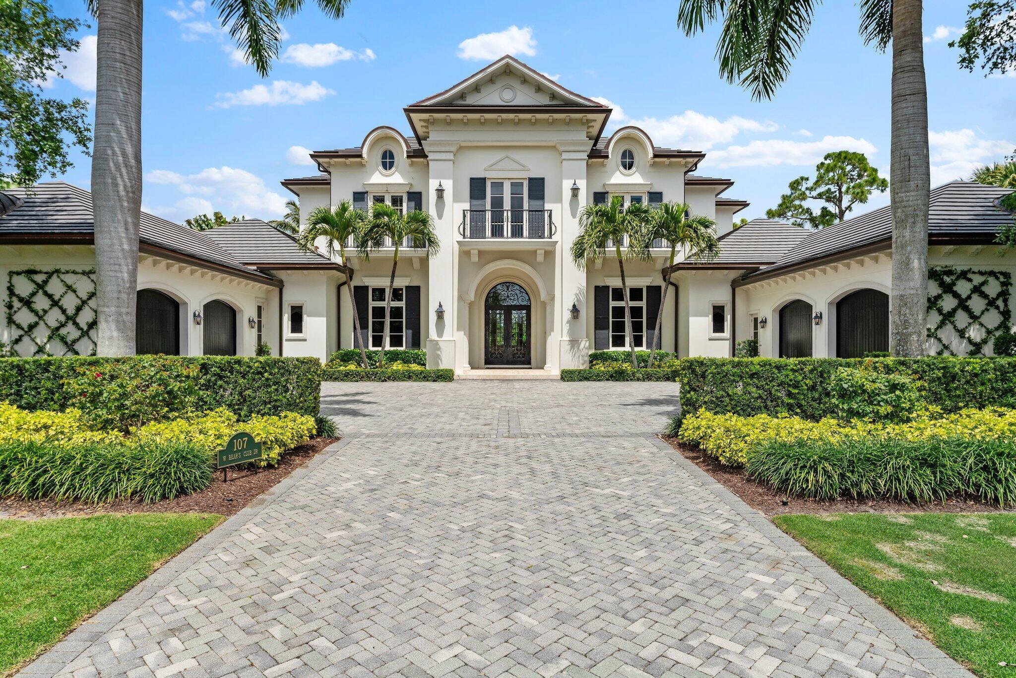 Stunning custom built estate in one of the most exclusive private communities in Palm Beach County, The Bears Club. This sprawling transitional estate offers 5 bedrooms in the main house with an additional bonus guest house suite attached to the main house with a lovely covered arched breezeway. With 5 Bedrooms, 8 full baths , and 2 half baths , this sprawling estate is nestled on nearly an acre of pristine manicured land offering some of the longest golf and lake views in The Bears Club. With extraordinary property features throughout, top tier finishes, and an upstanding transitional interior aesthetic,  Additional amenities include dual offices, home theater, full gym, wine room.  New Roof in 2022. AC square footage does not include newly enclosed loggia/summer kitchen.