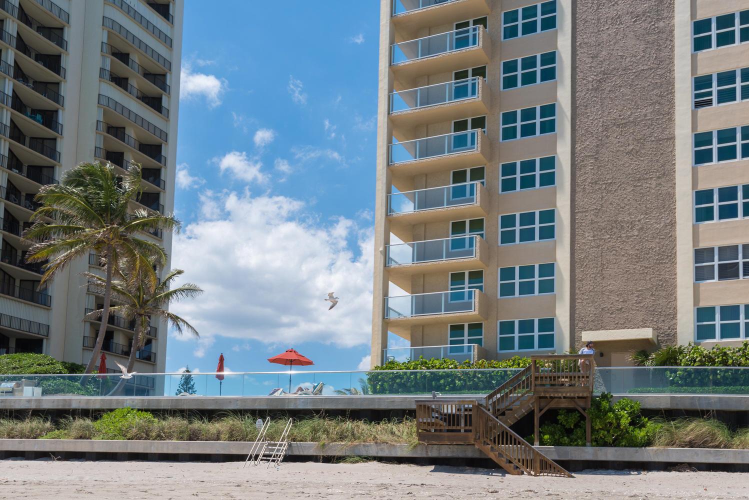 Gorgeous South Facing Oceanfront Condo with views of the ocean and Intracoastal! Condo features a contemporary open layout with impact glass sliding doors and windows. Interior features include all high end finishings, custom cabinetry, built-ins, tile flooring, pantry, custom blinds and bar. Master bedroom showcases a huge walk-in closet. Washer/Dryer Hook-up & covered parking! The unit also comes with extra storage on the floor and bike storage. The Aquarius has a new exercise room, sauna, billiard room, community room with kitchen, library, BBQ area with built-in gas grills and large picnic seating area overlooking the ocean. Enjoy relaxing on the beautiful pool deck which overlooks the ocean or lounge on the beach only a few steps away. Singer Island located is close to shops....