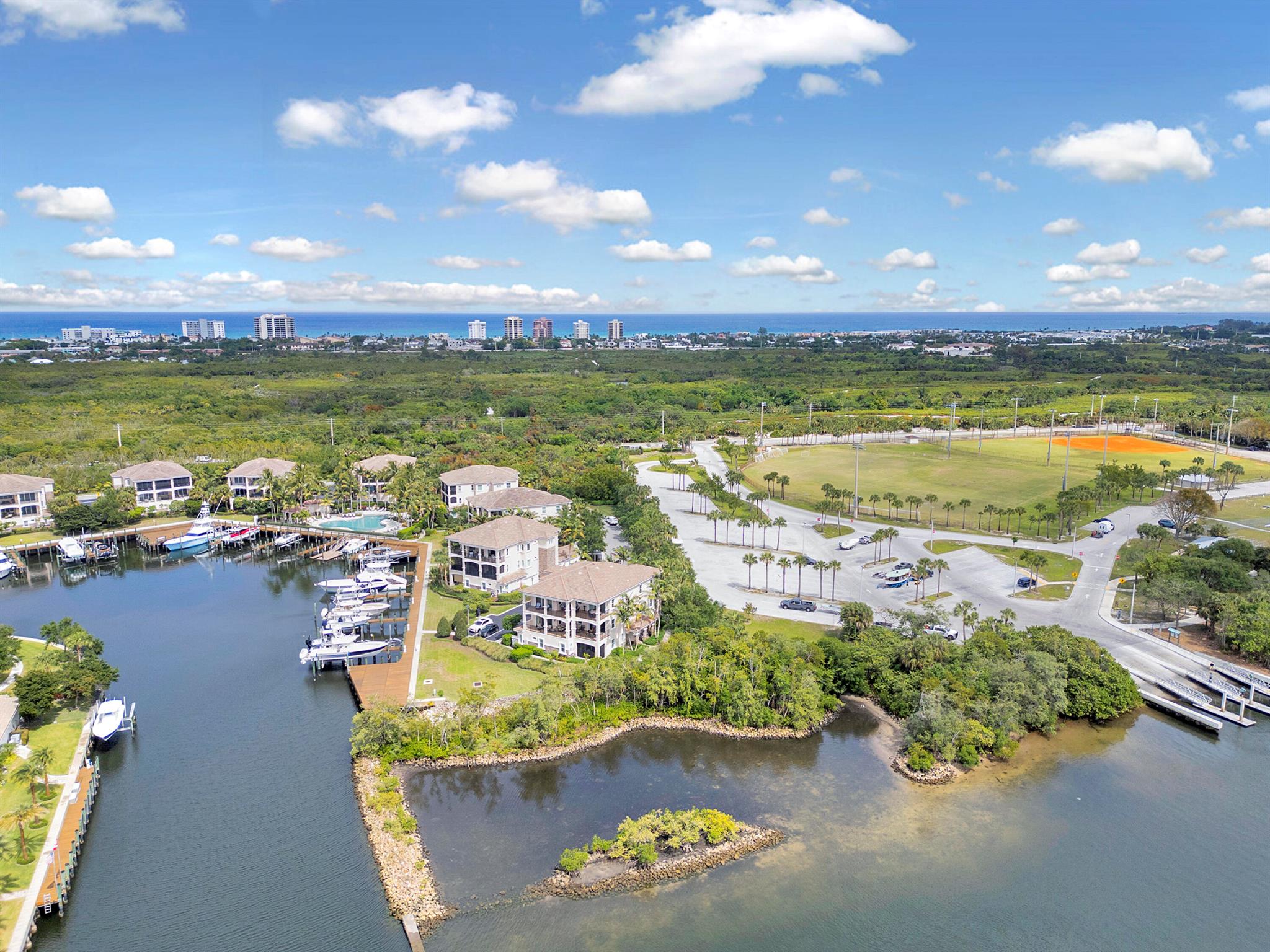 RARELY AVAILABLE! MAGICAL EXPANSIVE INTRACOASTAL WATERVIEWS the moment you enter this Penthouse residence. Boaters dream. Bring your 60 ft yacht and water toys to deeded boat slip in safe deepwater harbor. No fixed bridges. Quick access to Jupiter Inlet and Ocean. Coastal contemporary w/every imaginable upgrade. Private elevator opens to 3BD/2BA open concept floor plan loaded w/natural light. Large 2 car garage w/loads of storage.  Chefs  kitchen w/center island. Marble floors. Motorized phantom screens compliment LARGE wrap around balcony. Hurricane impact floor to ceiling sliders/windows.  Frenchmans Harbor is a 24/7 manned gated waterfront enclave of 78 residences and 30 carriage homes. Resort style pool/spa. Walking distance to pristine beaches, casual and fine dining, shopping,