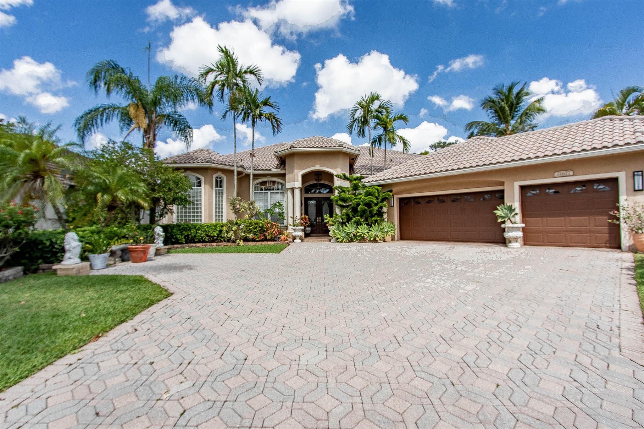 Introducing the Baccarat model, an elegant single-level residence situated in the prestigious 'Crystal Point' neighborhood within the guarded Boca Falls community. This home combines luxury with privacy and functionality. Boasting a well-designed layout, the residence comprises 4 bedrooms, 1 office, and 4.5 baths. The interiors feature high ceilings with crown molding, Ceramic Tile, hardwood floors, and abundant natural light. The expansive living space features a den that can be effortlessly transformed into a fifth bedroom, providing flexibility for families or visitors. The north side of the home includes three large bedrooms, whereas the south side has a spacious primary suite including his and hers walk-in closets, his and her full bathrooms, and a luxurious jetted soaking tub The living room seamlessly connects to a private patio overlooking a landscaped yard, screened-in pool, creating a perfect blend of indoor and outdoor living.

An airy home office provides a conducive environment for work, complemented by a full-size laundry room and a three-car garage with additional parking. The gourmet kitchen is a chef's delight, featuring custom cabinetry, granite countertops, and a breakfast island with bar-style seating.

Residents can enjoy upscale amenities including a fitness center, clubhouse, tennis courts, and scenic sidewalks. Conveniently located near I-95 and Florida Turnpike, the property is zoned for top A rated schools and is close to Boca Raton's premier dining, shopping, parks, and beaches.

Experience the luxurious lifestyle of Boca Raton - schedule your private showing today and seize this opportunity to own a piece of paradise!