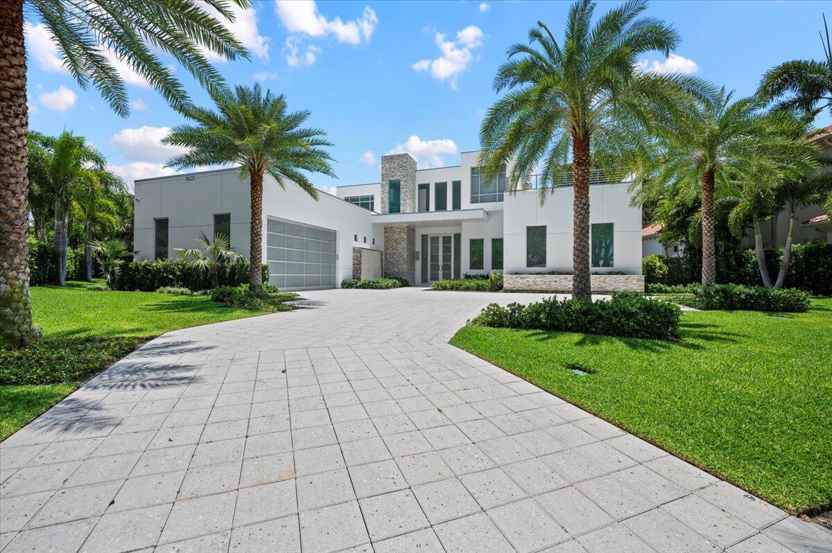 Exquisite Waterfront Estate at 2162 Radnor Rd, an unparalleled luxury residence in the heart of North Palm Beach. Almost a half acre located on over 55 feet of waterfrontage. This breathtaking waterfront estate embodies sophistication and elegance, offering an extraordinary lifestyle with panoramic views of the Intracoastal Waterway and a sprawling backyard space under ancient oak trees. This prime waterfront location is nestled in the prestigious enclave of Juno Isles in North Palm Beach. Boasting a 2024 seawall, brand new dock that can accommodate up to a 48 foot vessel, a 40k pound lift, full electric, ability to house a second lift and vessel. Located in a no wake zone with no fixed bridges and easy access to the Atlantic Ocean, ideal for boating enthusiasts. Situated on an oversized corner homesite, this expansive backyard functions as your own personal park and resort. Live like you are on vacation enjoying the views lounging on the covered lanai, cooking or entertaining in the outdoor kitchen, soaking in the pool or hot tub. The outdoor Florida lifestyle is made further convenient with the cabana bath, outdoor shower, and a spacious side-yard with sport court, that could be easily converted to a pickleball court or multi-use space.  

This architectural masterpiece was newly built in 2021 with meticulous attention to detail. Soaring ceiling heights, an expansive wall of windows and the open concept living spaces were crafted to maximize natural light and water views. Luxurious interiors, high-end finishes and designer fixtures create an opulent living space. The first level features the primary suite, an ensuite guest room, a home gym and an office overlooking the backyard and water views. A state-of-the-art chef's kitchen is a culinary dream, equipped with top-of-the-line SubZero refrigerator, WOLF induction cooktop, JennAir appliances, two refrigerator drawers, custom European cabinetry and an oversized waterfall island. 
The primary suite lives like it's own personal residence with access to private patio space, custom built-out walk in closets, a sitting room with coffee bar and a spa-esque primary bathroom with luxurious soaking tub and walk-in shower. Up the custom designed modern staircase, you will find another entire residence upstairs. A comfortable upstairs living area allows for privacy for family or friends and an oversized bonus room could function as a game room and/or theatre room. An upstairs laundry room offers additional convenience and storage space. There are three spacious guest suites upstairs, each with a walk-in closet and gracious terraces overlooking the views.
Additional home features: wide plank wood floors throughout the residence, electric blinds, water purification system, solid wood core doors and high-hat lighting. The climate-controlled garage has a brand new lift, epoxy floors and additional storage cabinets.

Experience the epitome of luxury living at 2162 Radnor Rd, where every detail is designed to exceed your expectations. Schedule your private tour today and step into a world of unparalleled elegance and sophistication. Ideally located near Florida's pristine beaches with close proximity to world-class golf courses, fine dining and shopping.