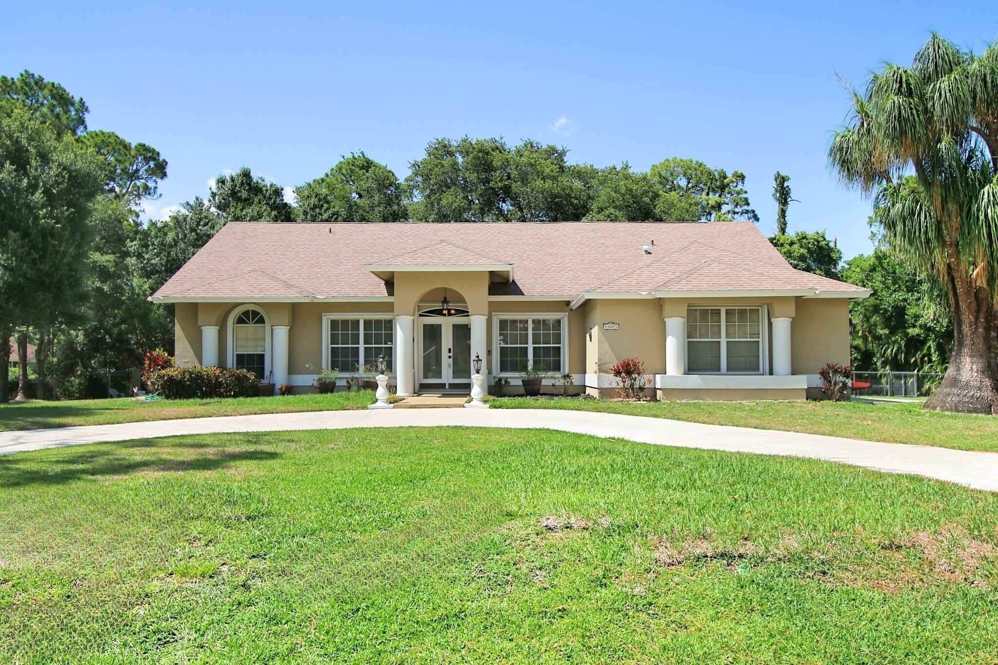 Beautifully situated on 1.15 acres, this oversized 3 bedroom, 2 bath, 2 car garage home, complete with an outdoor shed has so much to offer! Plank tile flooring throughout the main home and brand new luxury vinyl adorning the master bedroom.   The spacious layout features a large split floor plan, a recently updated kitchen with newer, upgraded appliances, and updated baths.Brand new hot water tank, newer ac, water filtration system, and pump. Septic system has been inspected and serviced prior to listing. Roof is 16 yrs and insurrable through Citizens for a guaranteed 25 years. Property has a full sprinkler system, pulled from the fresh water pond. No need to worry about hard water stains! 

Rear yard is enclosed, including separate fencing around the pond. Don't miss the opportunity to make this sanctuary your own!