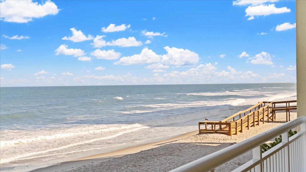 Huge Price Adjustment!! Best priced unit for this model. Welcome to your dream beach getaway! Stunning 2019 luxury beachfront condo blends modern coastal charm with breathtaking natural beauty. Thoughtfully designed, it features a spacious open living area, oversized kitchen w/tons of counter space and cabinets, wood-look tile flooring, ample storage and a large private balcony with triple impact glass sliding doors and new accordion shutters. Plus your own garage perfect for your car surf boards & beach toys! Enjoy sunrise views, direct beach access, a heated pool, clubhouse, and nearby shopping and dining. Just minutes from Cocoa Beach and less than 15 min to I95. Watch the rocket launches from the beach or your patio. This home truly epitomizes coastal living in Brevard County, Florida