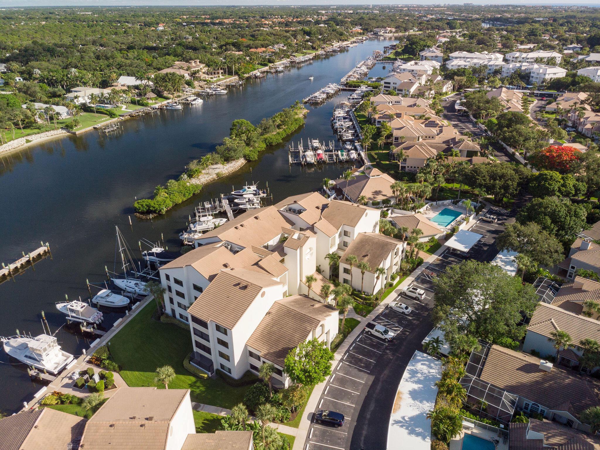 Fully renovated 2-bed,2-bath second-floor condo.DIRECT panoramic intracoastal views.Watch yachts sail & spectacular sunsets.New flooring throughout flows to the open living & dining areas.Remodeled kitchen features new cabinets,quartz countertops & stainless steel appliances. The spacious primary suite offers a resort-style bathroom.Large guest bedroom on the opposite side provides privacy.A glassed private patio with sliding windows extends your living space. Includes full washer/dryer,covered carport,storage,upgraded cable & internet.Oak Harbour is a gated boutique community directly on the intracoastal with lush landscaping.On-site management,clubhouse overlooking the waterway & marina,2 heated pools,tennis/pickleball,BBQ area,Gym.Boat slips available for lease/purchase.Close to beach