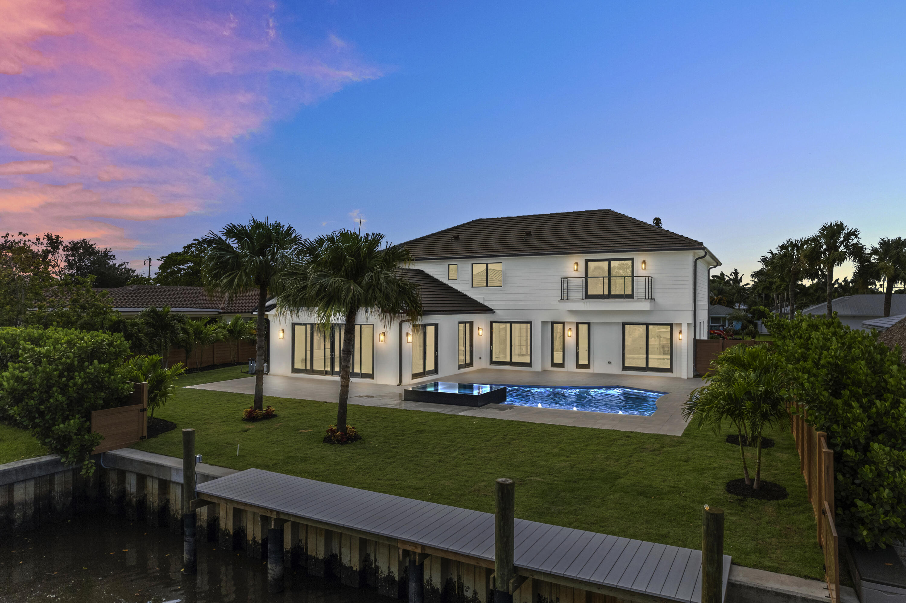 Absolutely gorgeous remodeled modern waterfront home located in the desirable Village of Tequesta. Enjoy an idyllic setting along the Loxahatchee River in this CBS 5 bedroom, 6 bathroom home offering 60' of private waterfront and a private 34' dock, with ocean access & one 14' fixed bridge.No expense was spared on the construction of this impressive residence, with designer selections hand picked throughout the 3,920 sq. ft. of living space and 4,755 Sq. Ft. total. Enjoy the highest quality appliances and fixtures in the massive chef's kitchen, complete with marble countertops, custom cabinetry, and hidden walk-in pantry. The primary suite exudes luxury with a private balcony, a generous walk in closet, and spa-like bathroom.In the private backyard you have resort-style amenities; a modern heated saltwater pool with sunshelf and spa, large format marble pavers, and composite dock with electrical and water hookup. 

You can't beat this location, with swift intracoastal access for boating and centrally located to Tequesta's best restaurant and shops, A-rated schools, and amazing parks. Easy access to beaches, highways and airports.
