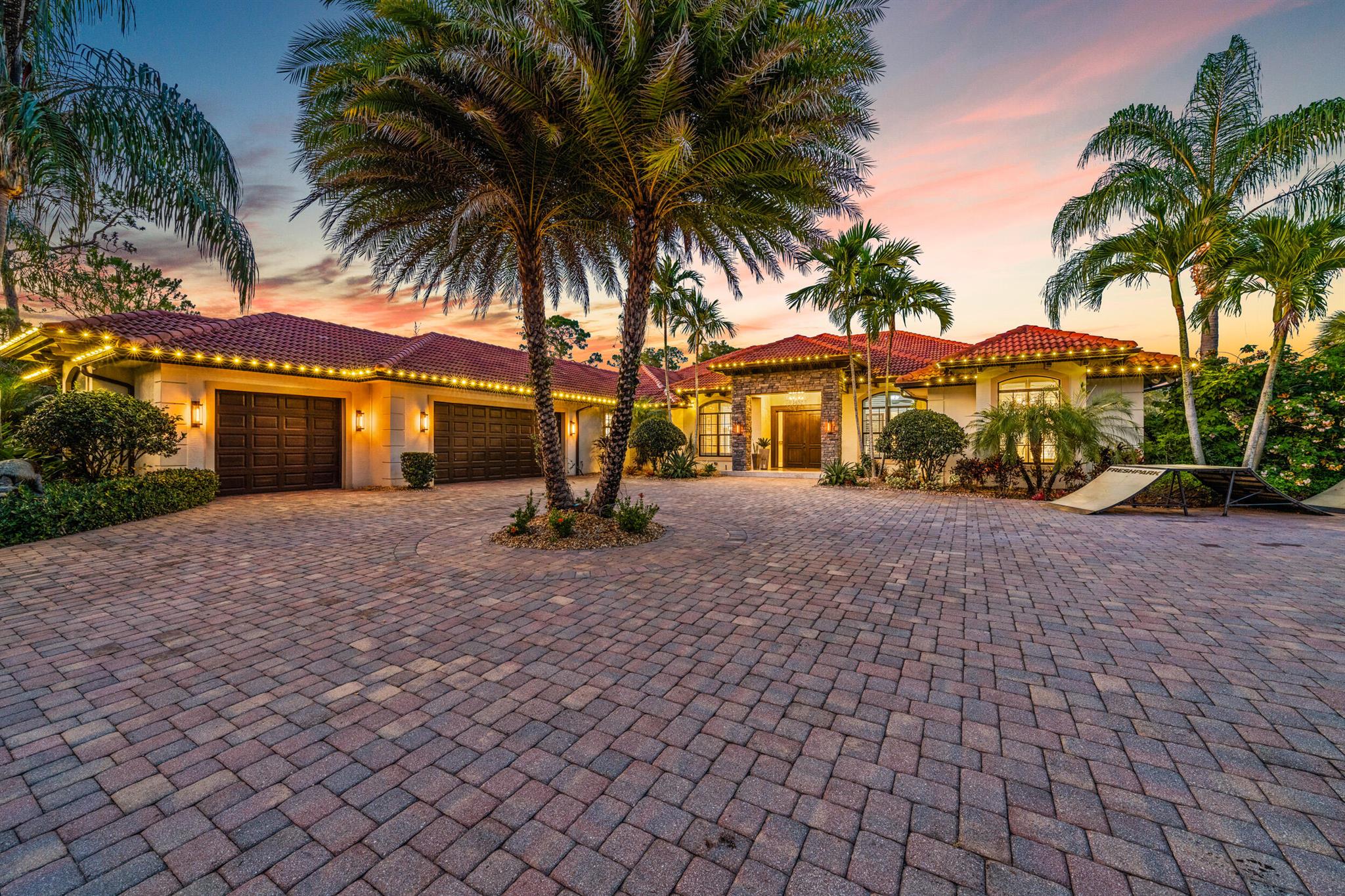 Welcome to a custom-designed paradise, a move-in ready and fully-outfitted waterfront estate priced at $6,425,000 and nestled in the coveted Jupiter zip code while benefitting from Martin County taxes. This magnificent 3-acre property offers unmatched privacy and breathtaking sunsets over Jonathan Dickinson State Park and the Loxahatchee River right from your backyard.Spanning over 6,000+ square feet, the main property features five spacious bedrooms and four well-appointed bathrooms. The home includes a 3-car garage, providing plenty of storage and parking, and a 1,200 sqft private gym equipped with a cold plunge for post-workout recovery. The expansive living areas are designed with impact glass throughout, ensuring safety and comfort. Additionally, the property is equipped with a one-year-old full-house Briggs &amp; Stratton generator, ensuring uninterrupted power supply.
Outdoors, the spa-inspired backyard boasts a luxurious pool, swim spa, and fire pit, perfect for entertaining family and friends. Enjoy direct access to the Intracoastal with a private dock, two floating boat slips, and four jet ski floating docks. The property also includes a boat launch, accommodating up to a 41-foot center console boat with a recently dredged canal, and is ready for an RV with septic, full water, and electrical hookups.The recently remodeled and updated kitchen is ideal for hosting gatherings, while the two entrances to the property offer flexibility for additional structures such as a large car garage or guest house. Located just minutes from Jupiter and Tequesta, this estate provides easy access to numerous retail amenities, deep-sea fishing, water sports, fine dining, diving, tennis, and world-renowned golf courses. With close proximity to I-95 and the Turnpike, this home offers both tranquility and convenience.This spectacular estate is a rare find, offering a blend of luxury, privacy, and convenience. Don't miss the opportunity to own a piece of paradise in one of Florida's most sought-after locations.
