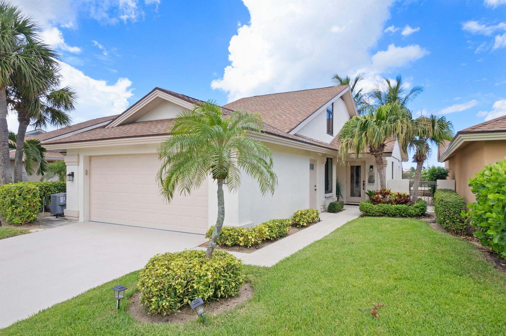 Welcome to The Bluffs a Jupiter Beach Paradise! You will fall in love with this completely RENOVATED Bluffs home the moment you arrive. Walk to the turquoise waters of Jupiter Beach & the Juno Pier from this light & bright 3 bedroom + den residence located high on the Ridge.  Gorgeous east exposure, feel the ocean breezes and listen to the sound of the waves. Relax on the private elevated deck & watch kiteboarders sail along the beach. Custom features: Shell stone & wood flooring throughout, custom millwork, office/den in large sunny loft, extended kitchen w/granite c-tops, french doors, coquina wood burning fireplace, ALL impact glass, atrium dining room, Premier Garage flooring & storage systems.  Community heated pool, tennis/pickleball/playgrounds.  Perfect Beach Retreat!